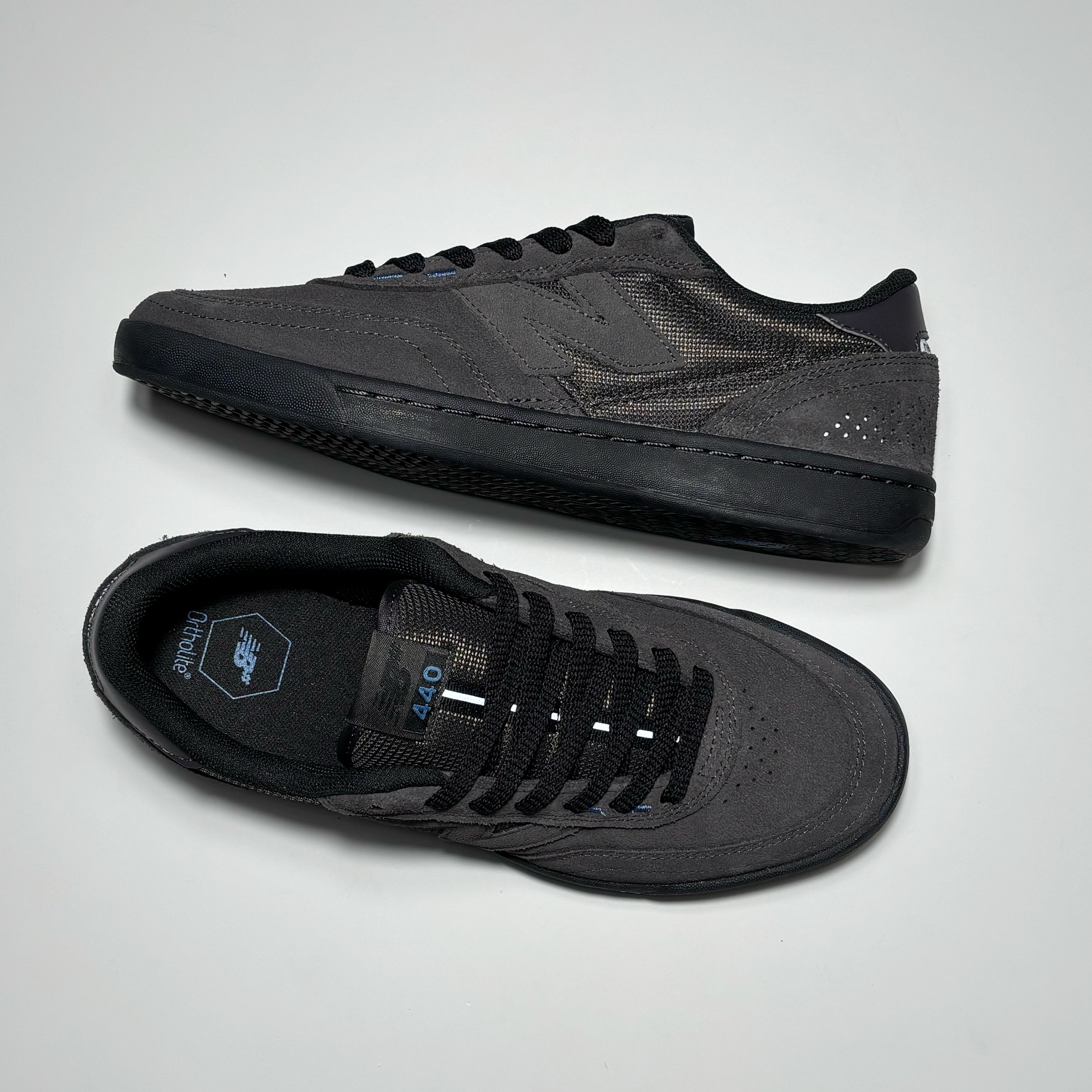 Toe down view with side profile. 
NB 440 woven label on tongue.