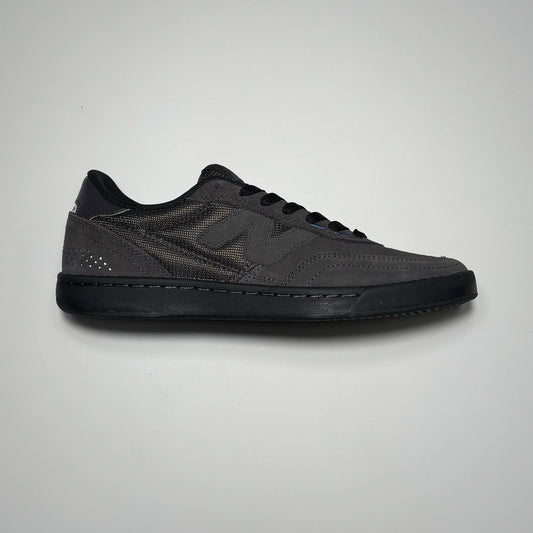 Side image of right shoe. Black cement suede with black outsole.