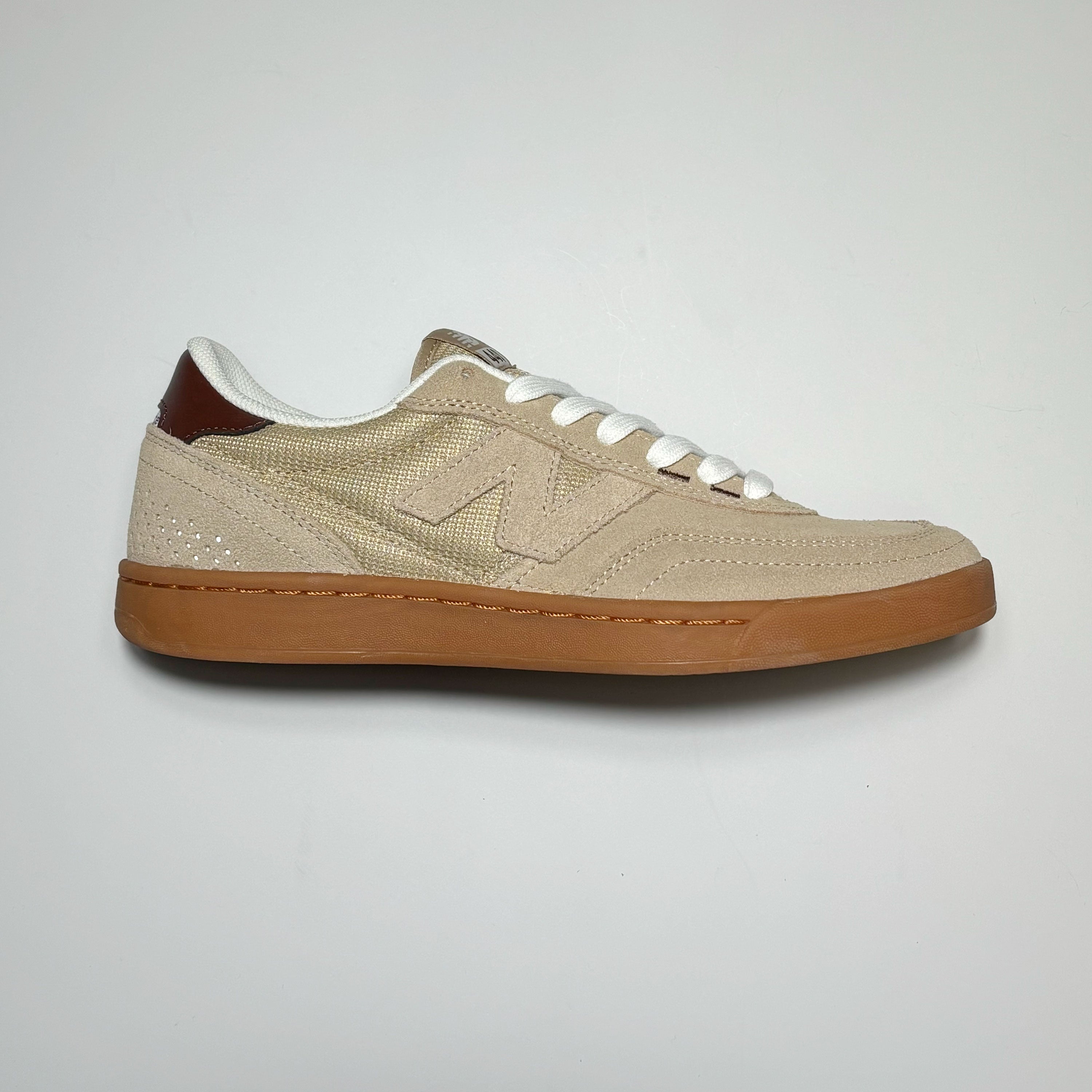 Side image of right shoe.
Tan suede with um outsole