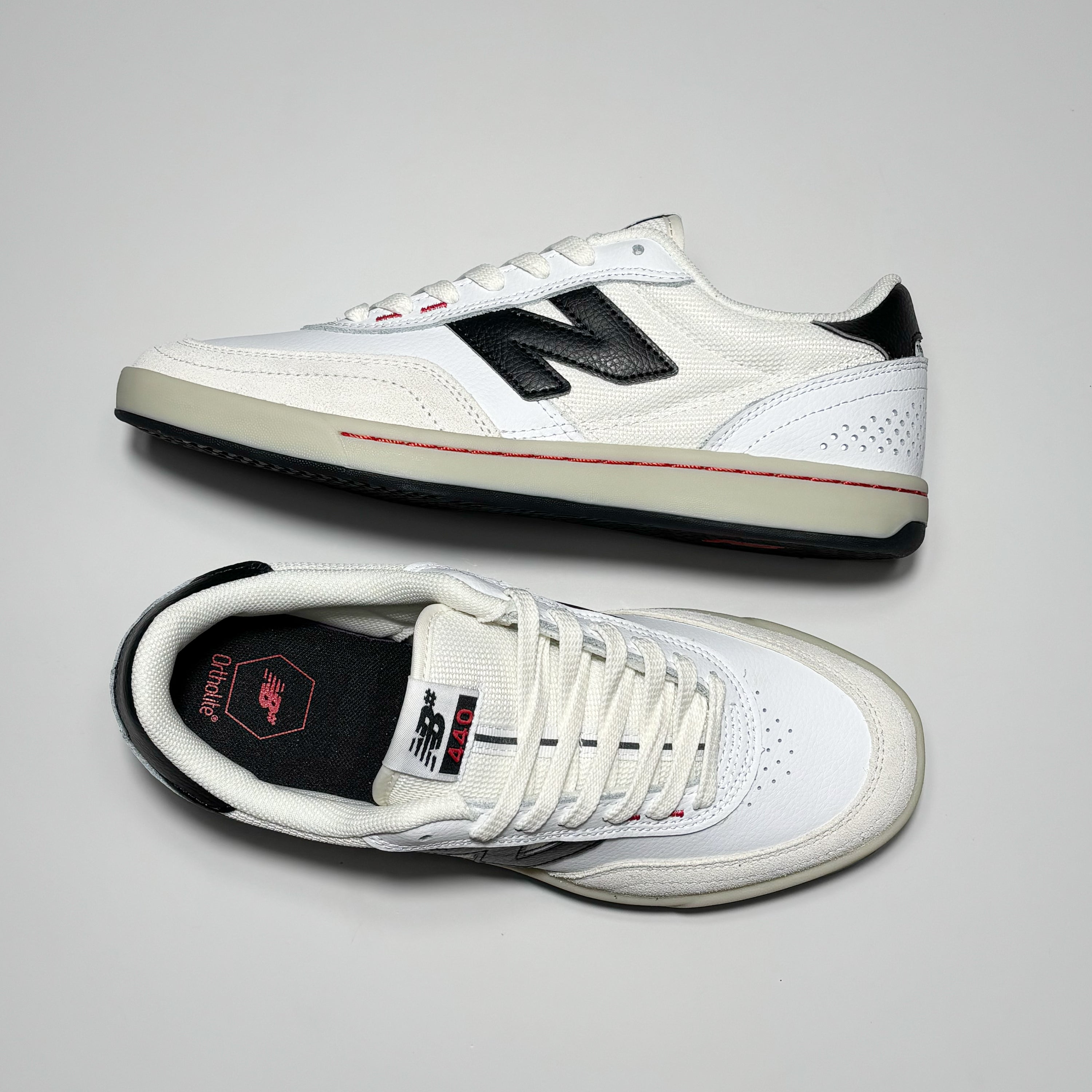 Toe down view with side profile.
NB# woven label on tongue.