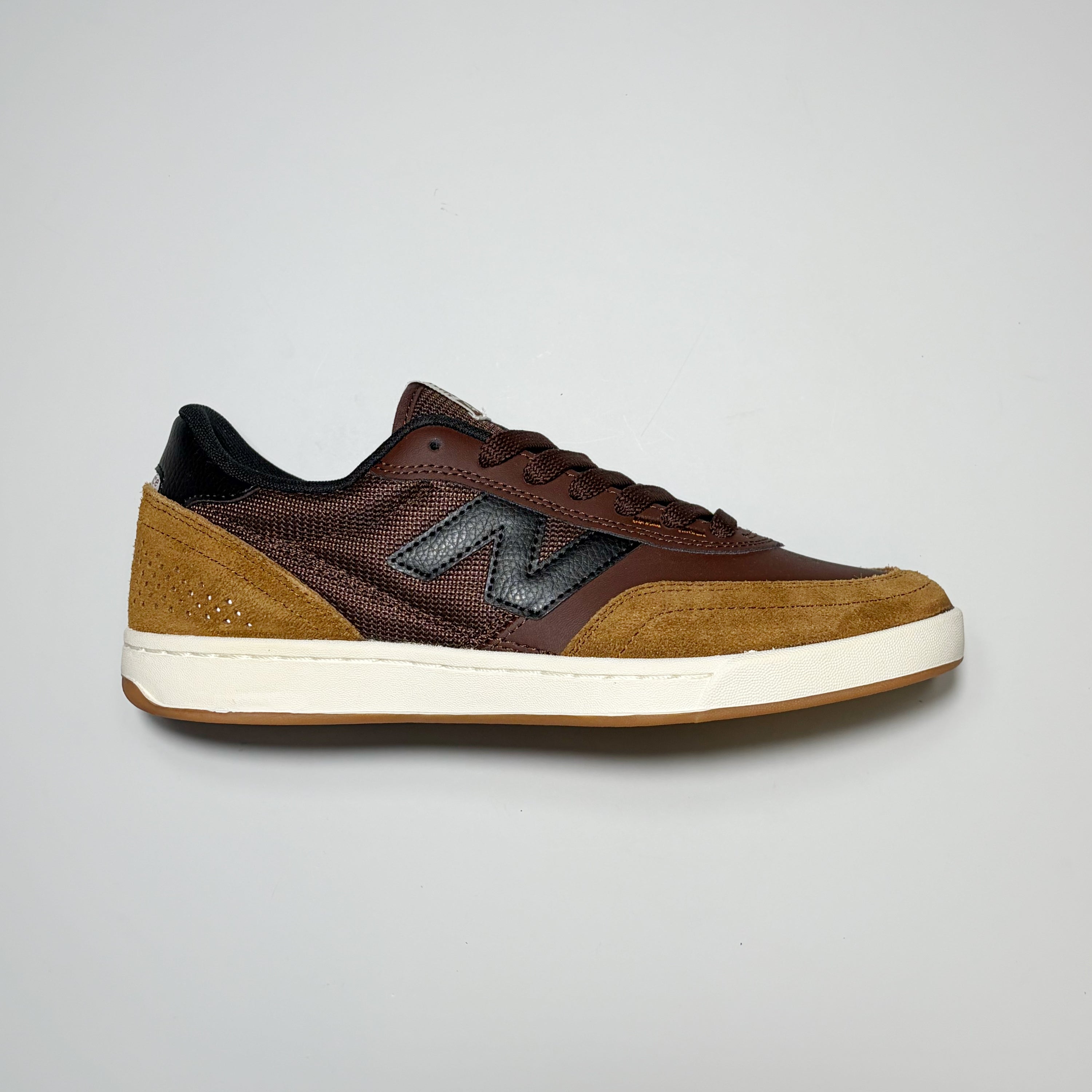 Right side image, New Balance Numeric NM440 shoe. Light brown suede with dark brown leather and white midsole.