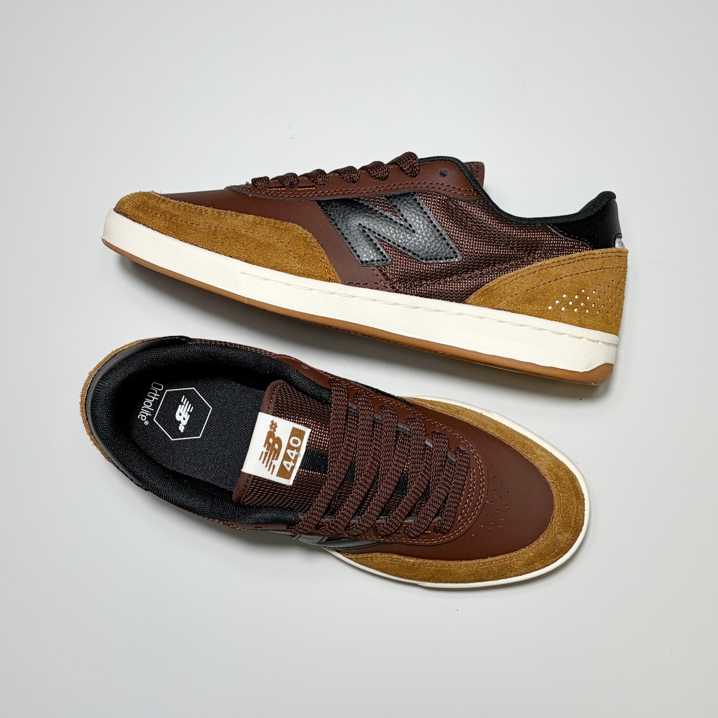 Pair of New Balance Numeric NM440 shoes on white background.