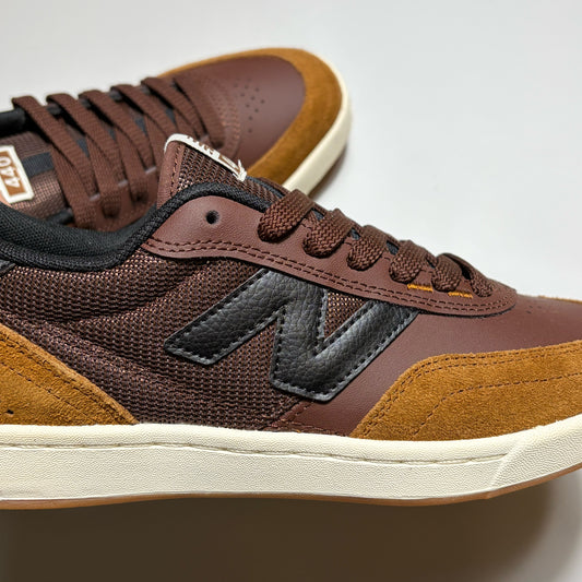 Close detail of black "N" branding on mid-panel
