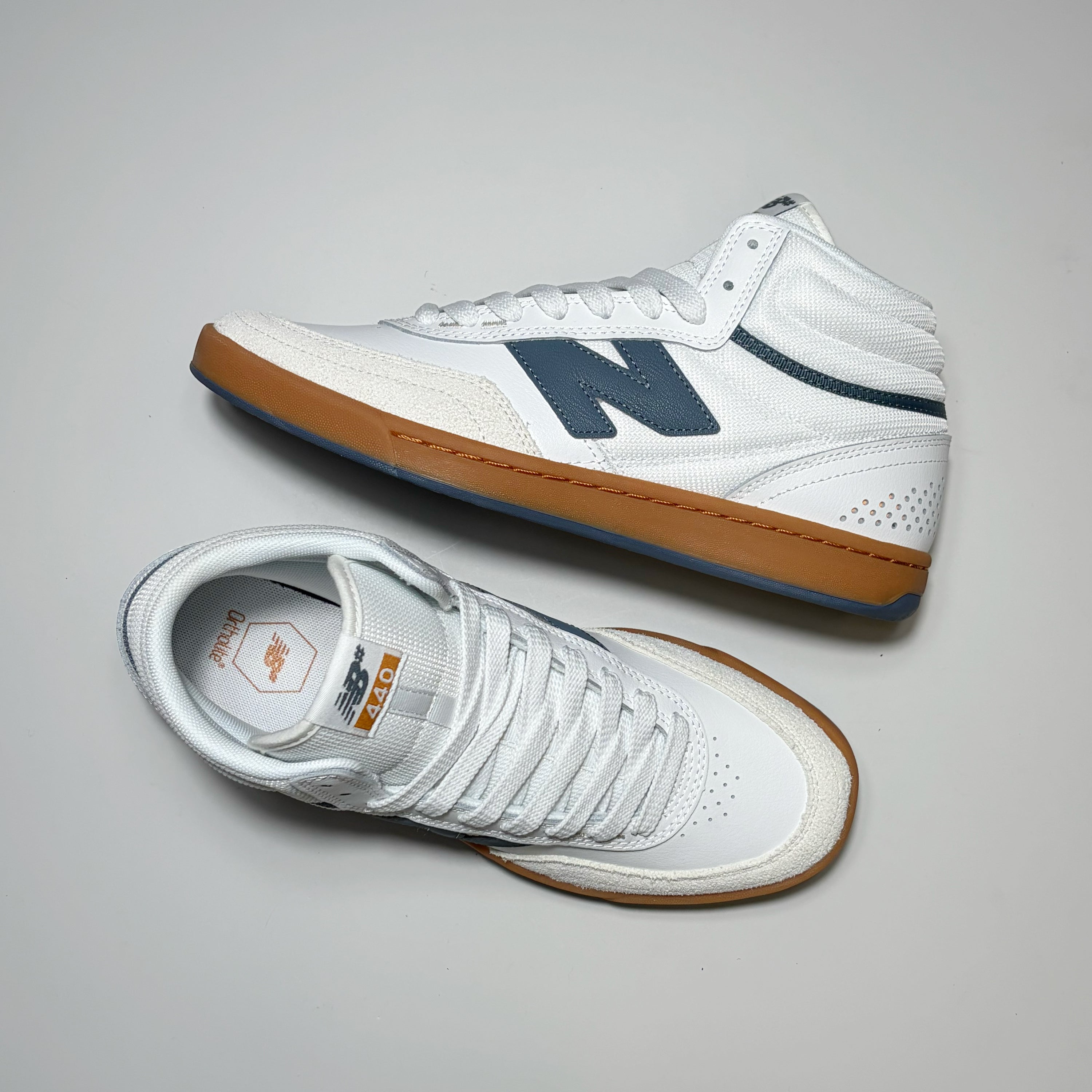 Pair of New Balance Numeric NM440 High V2 shoes.