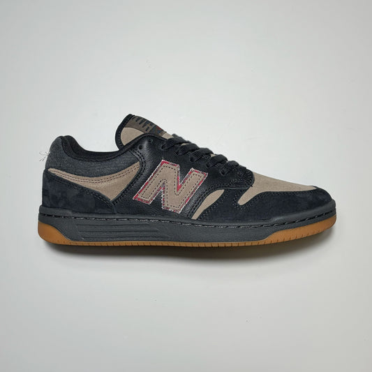 Side image of right shoe, black/brown New balance NM480 shoe with brown N on side panel.