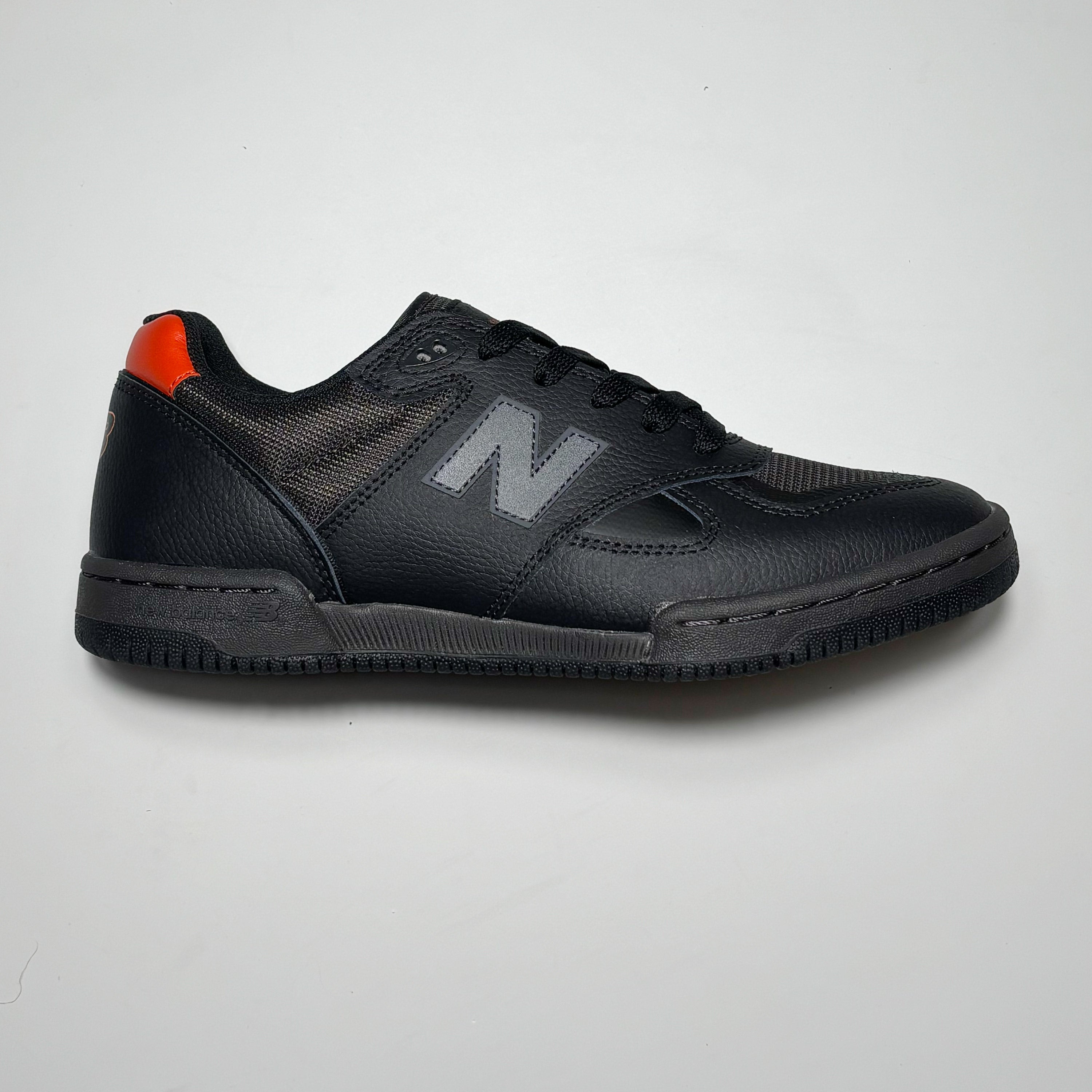 Side image of right shoe.
Black full grain leather with reflective N branding.