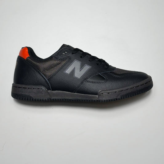 Side image of right shoe.
Black full grain leather with reflective N branding.