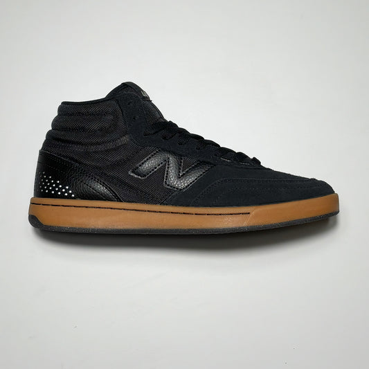 Side image of right shoe.
Black suede with tonal N branding on mid-panel. Gum outsole.