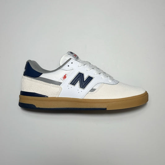 Right side image, New Balance Numeric Footwear Jamie Foy NM306C shoe. 
White suede with blue 'N' branding and gum sole. 