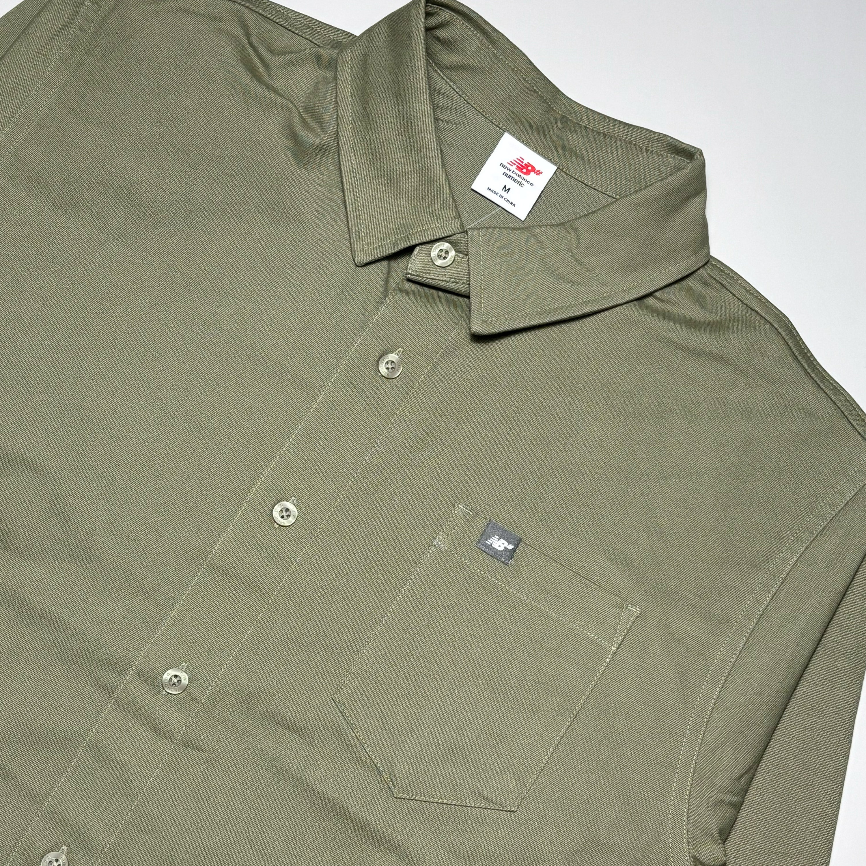 Close detail of pocket and buttons.