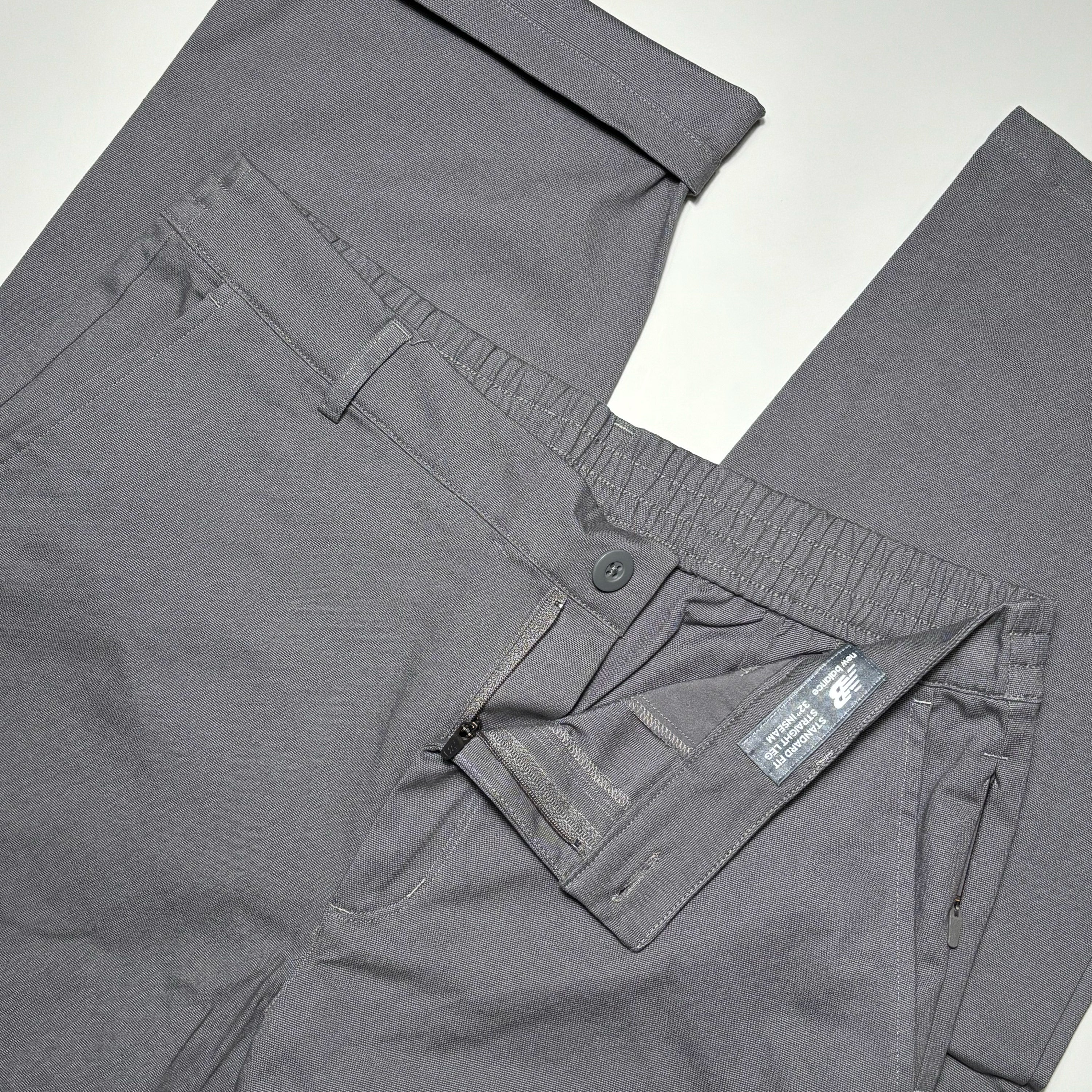 Close detail of button closure and elastic waistband for comfort.