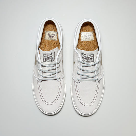 Pair of Nike SB Janoski shoes from a toe down view. Classic leather laces and a cork-textured footbed.