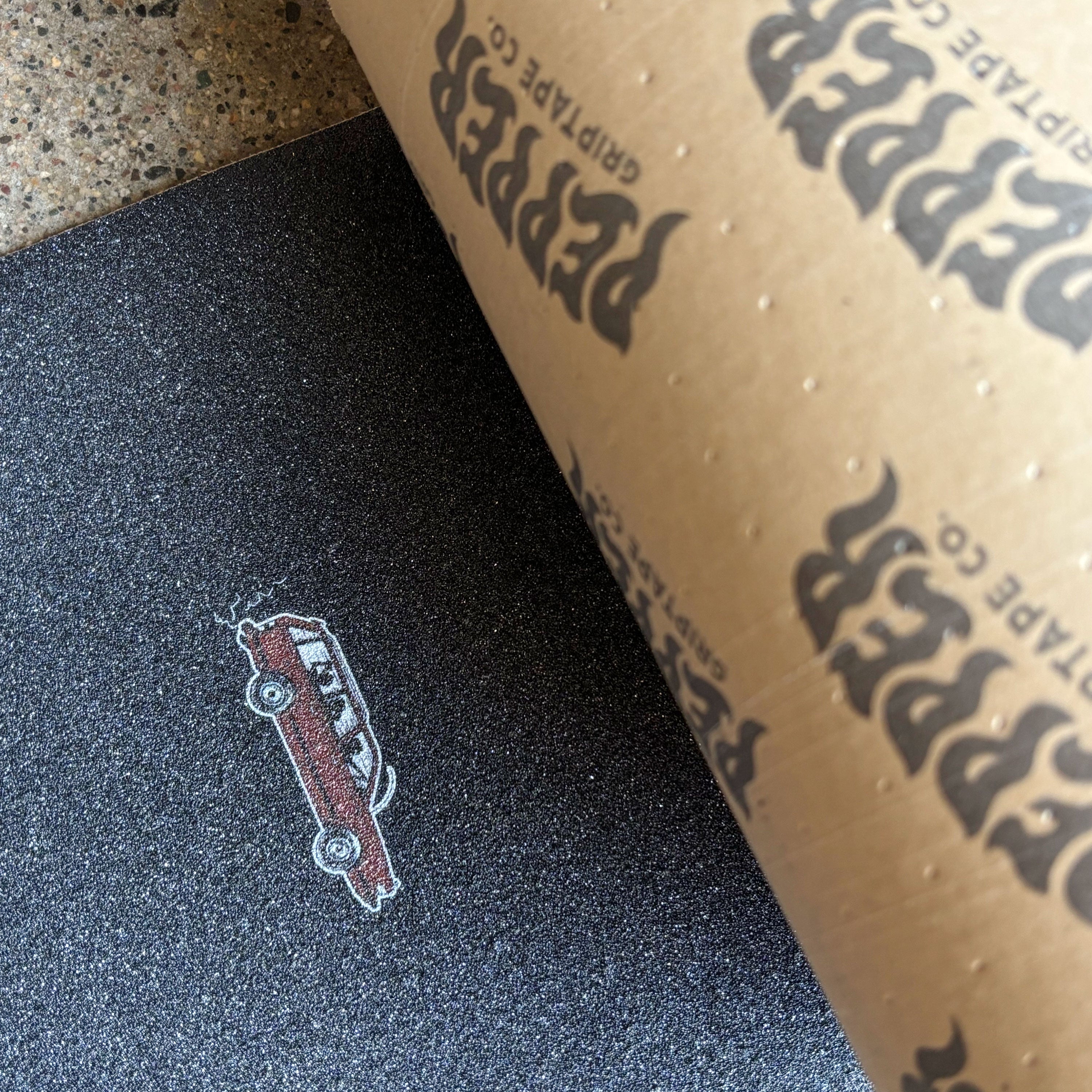Close detail of Pepper grip with red wagon art printed by tail.