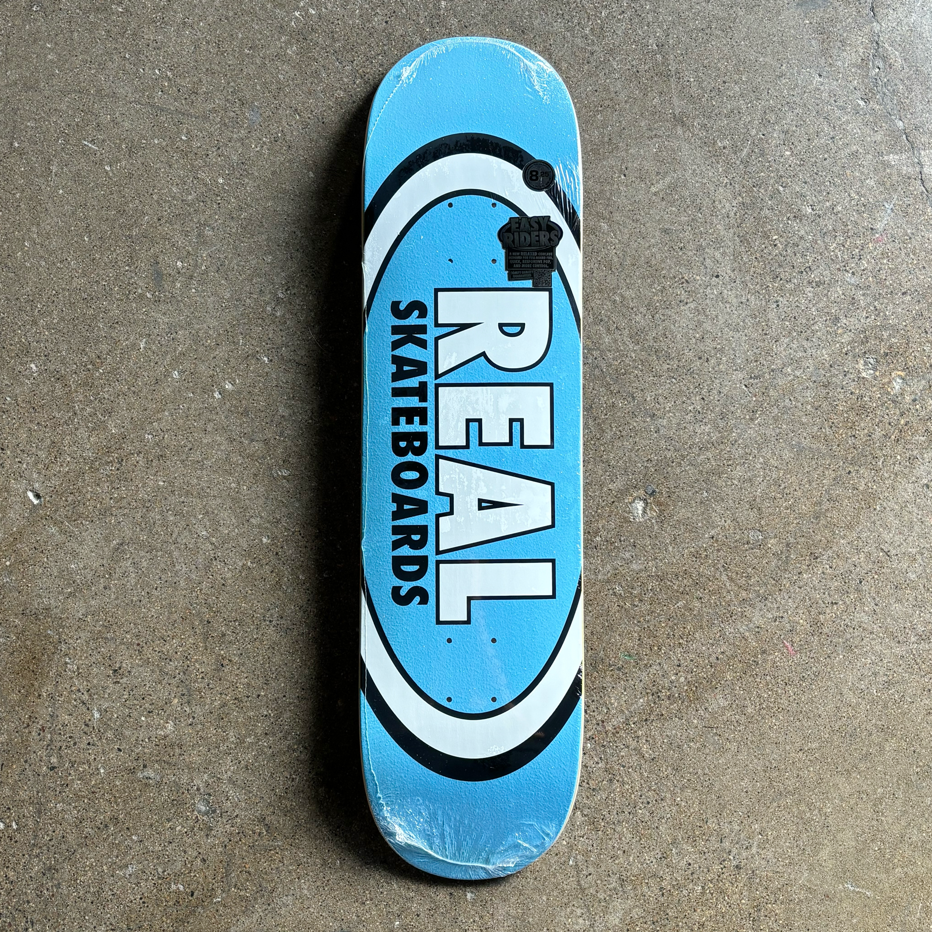 IMAGE OF BLUE BACKGROUND WITH REAL SKATEBOARDS FONT OUTLINED IN BLACK