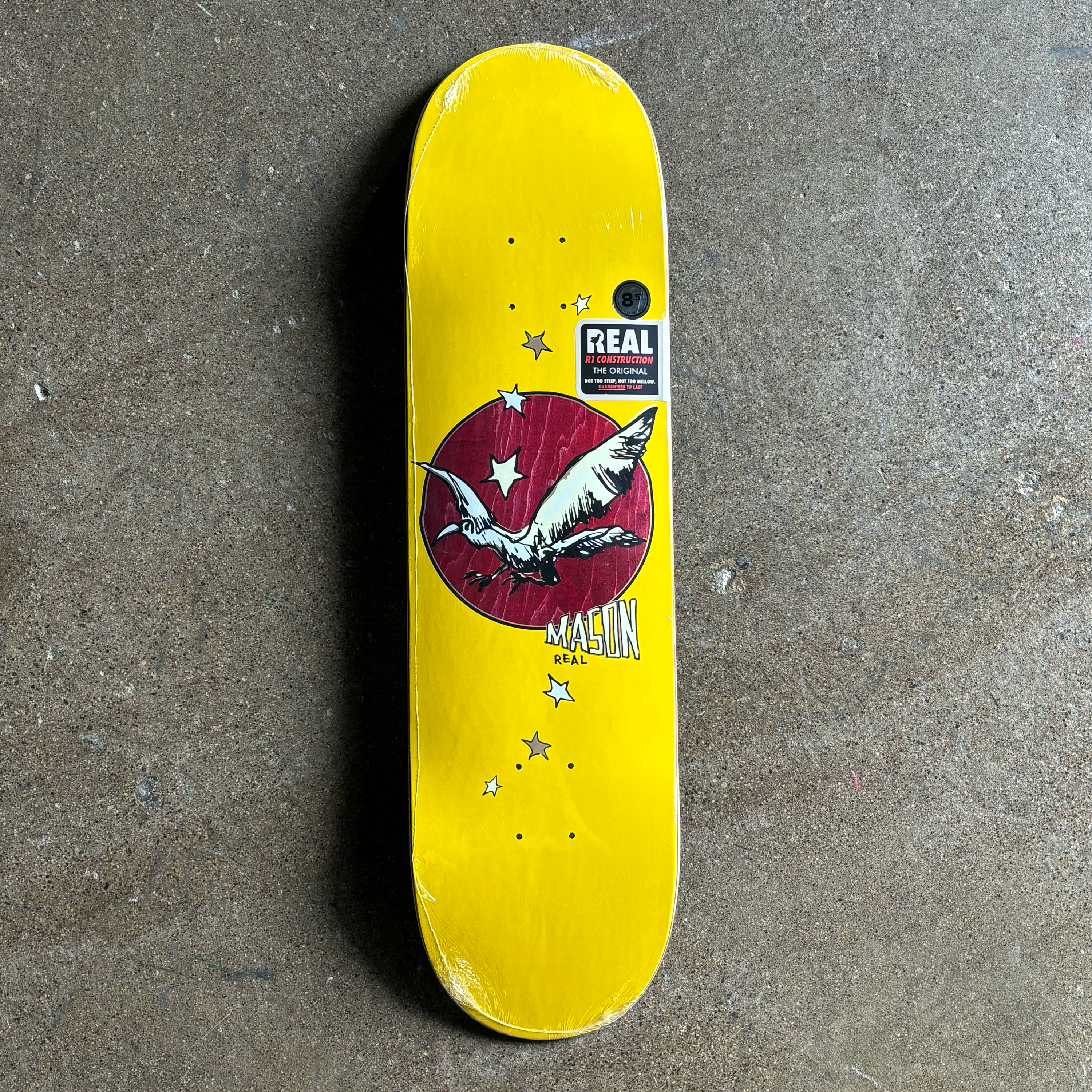 IMAGE OF ENTIRE DECK
YELLOW BACKGROUND WITH BIRD DRAWN BY MARK GONZALES ON EXPOSED RED VENEER