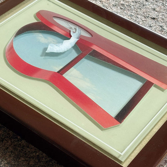 Close detail of collage artwork layered in custom epoxy resin frame.