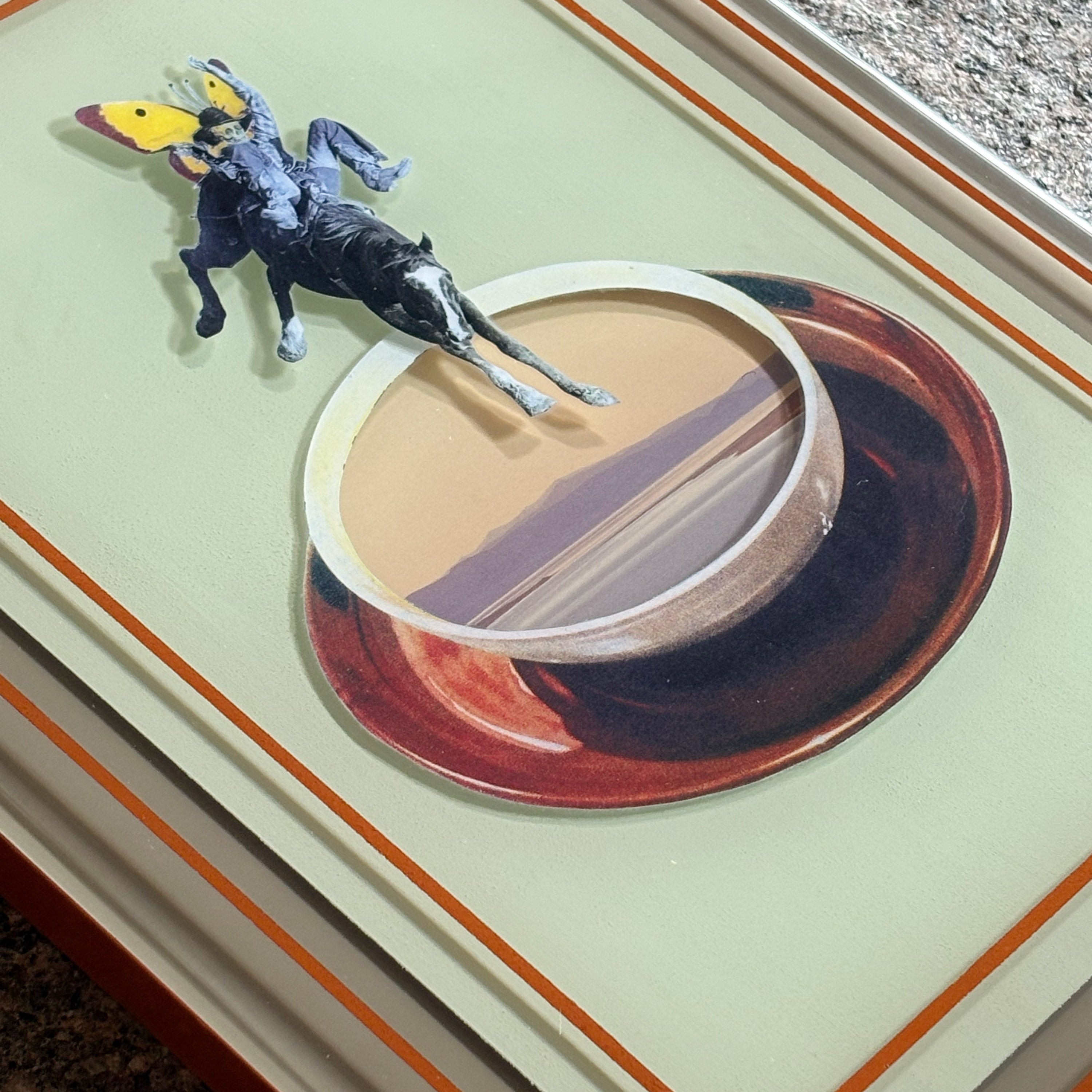 Close detail of the collage artwork, encased by custom epoxy resin.