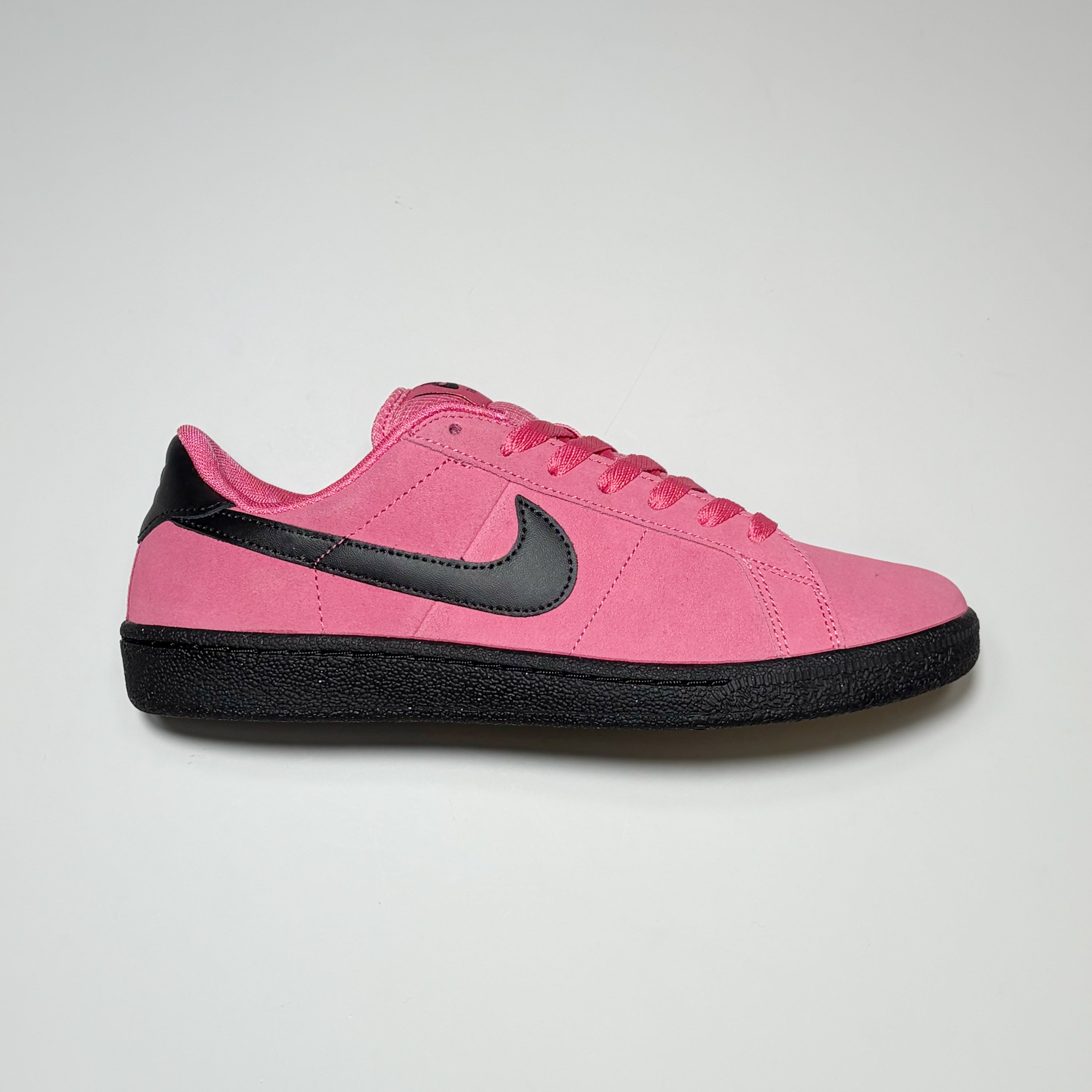 Right side image, Nike SB Zoom Tennis Classic SB FC shoe. Hyper pink/black suede with black swoosh and midsole.