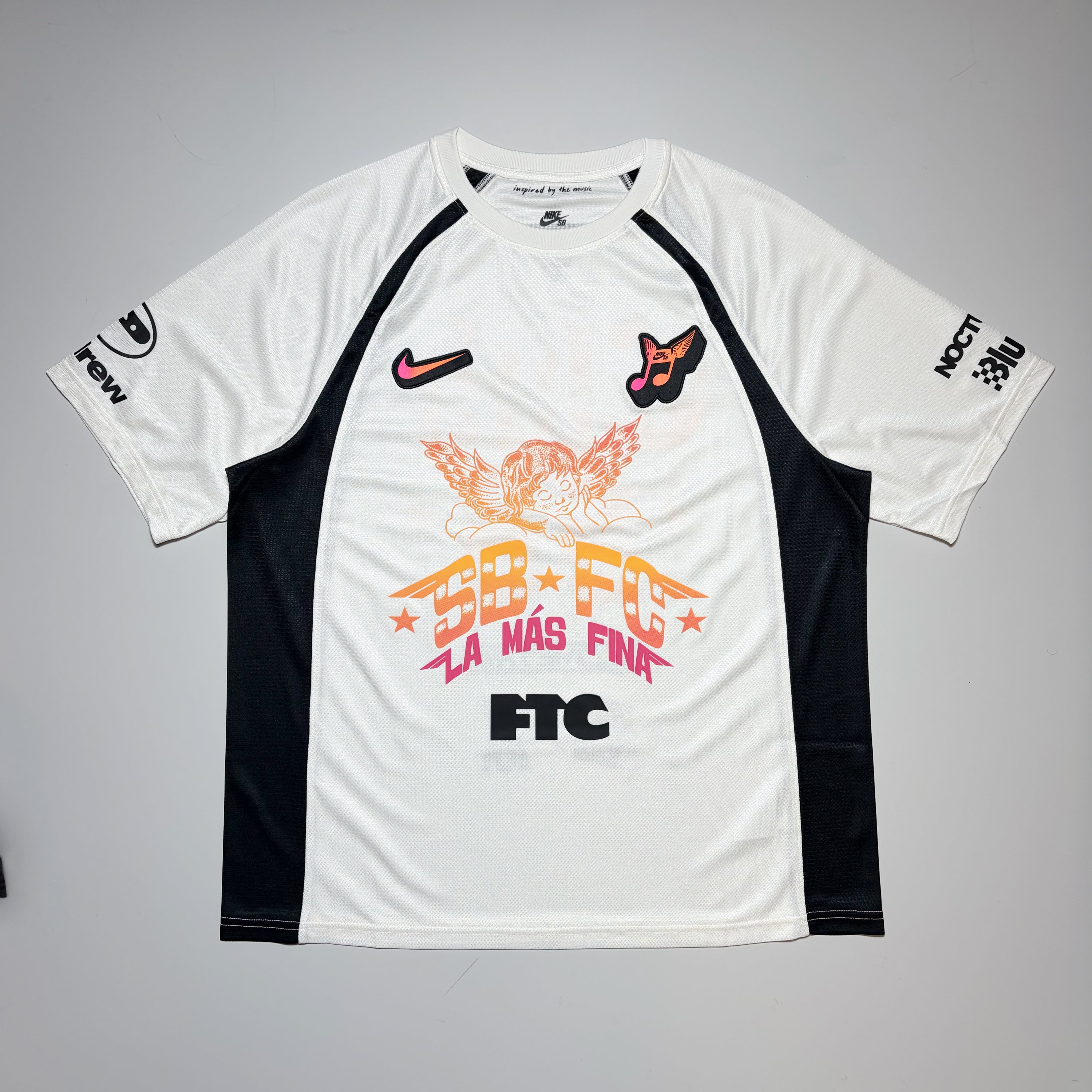 Full front image, Nike SB FC club 58 jersey. Art printed on front and sleeves with embroidered patches on chest.