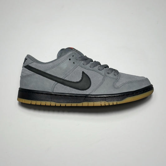Side image of right shoe. Grey nubuck and suede with black midsole and swoosh.