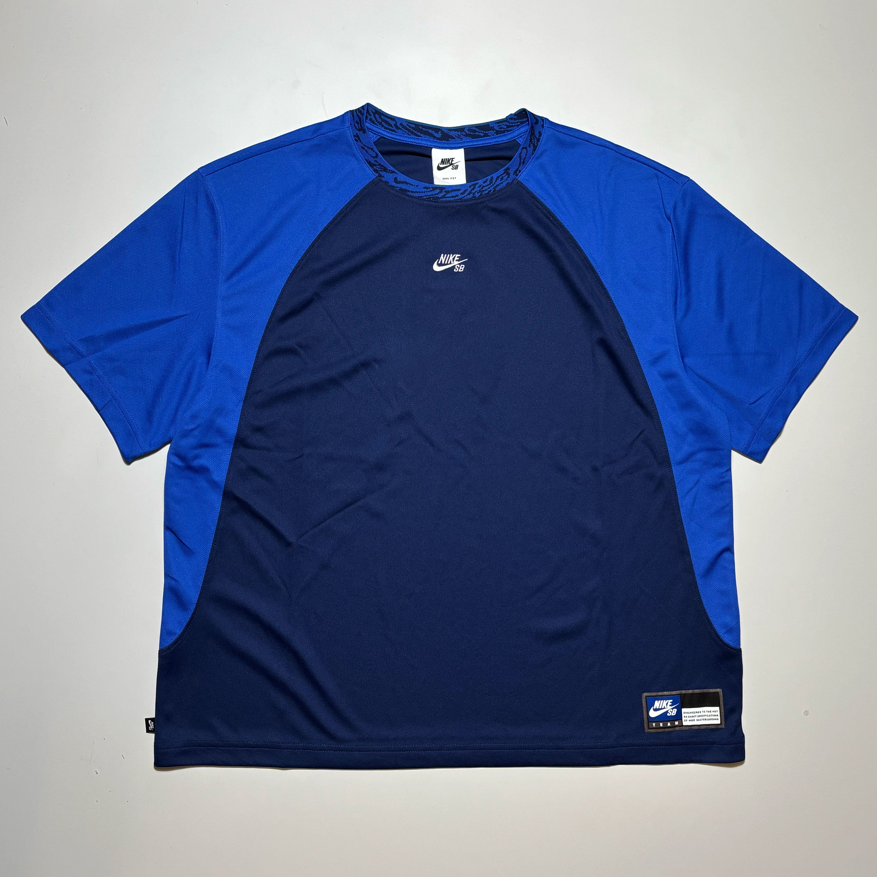 Full front image of navy/blue color blocked jersey. Nike sb logo embroidered on chest.