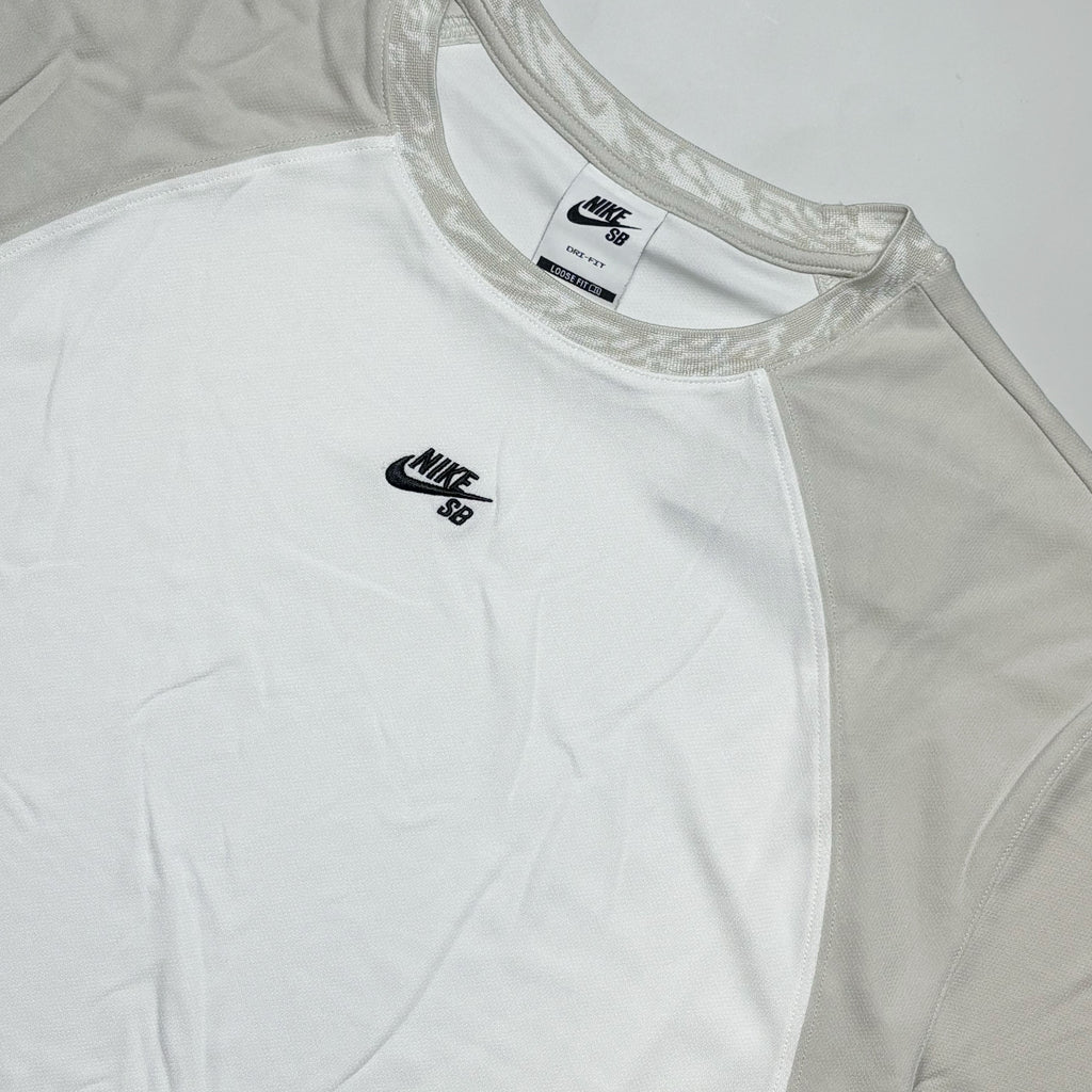 Close detail of embroidery and jacquard neck.