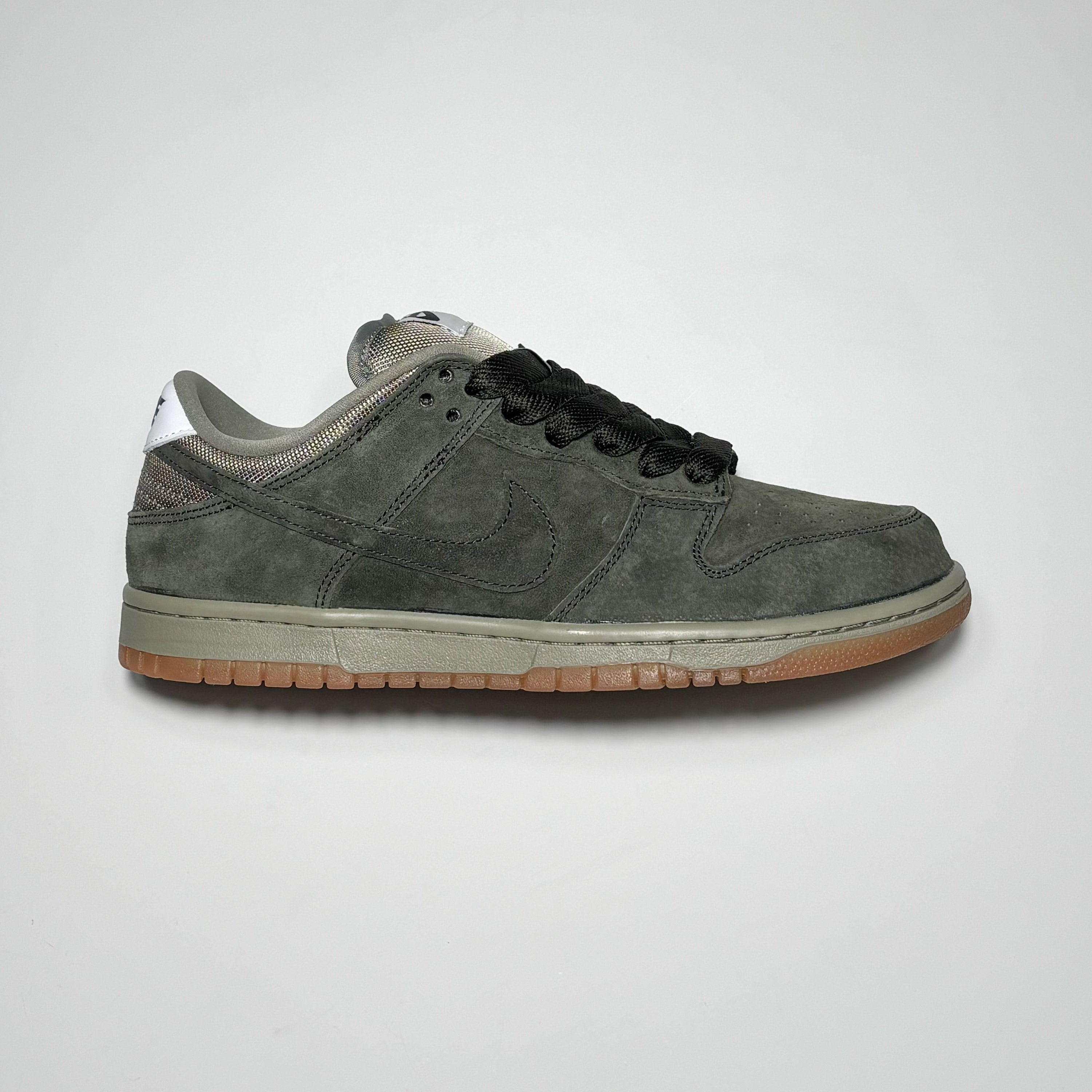 Side image of right shoe. Sequoia green suede with grey and gum outsole. 