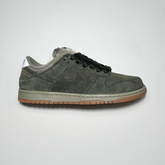 Side image of right shoe. Sequoia green suede with grey and gum outsole. 