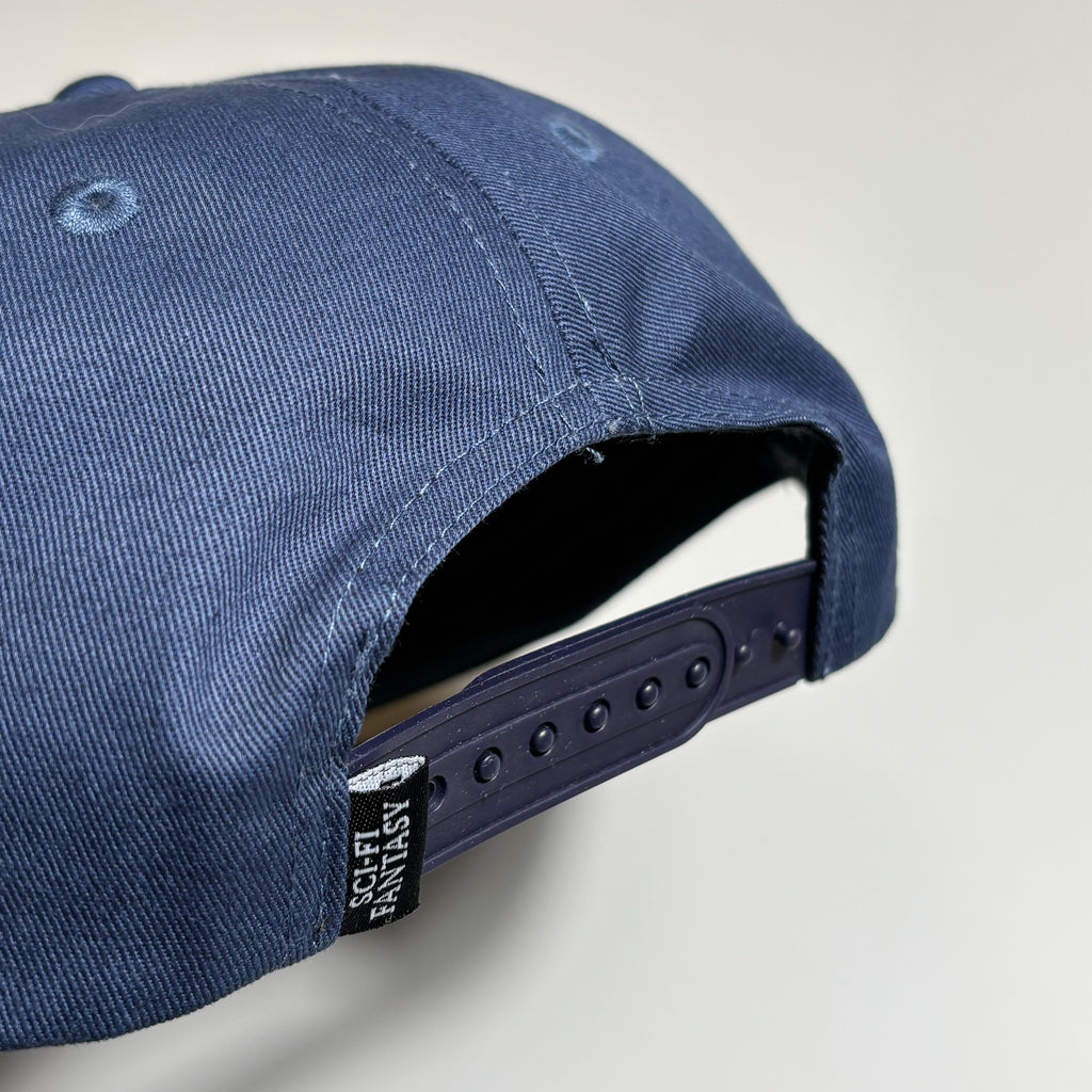 Back closure details. Snapback with woven label on side. 