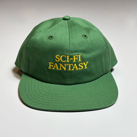 Front image of green Sci-Fi Fantasy logo hat with text embroidered in yellow on crown.