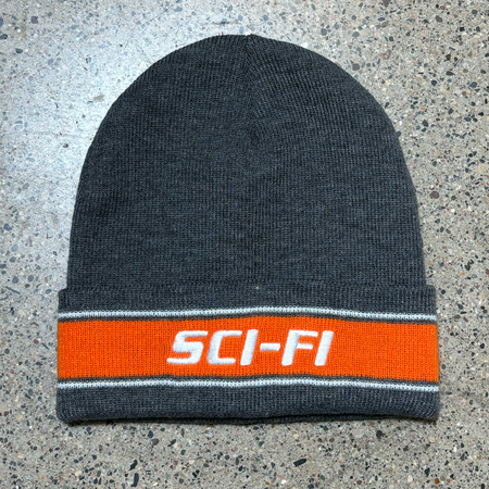 Full image of grey beanie with orange stripe and sci-fi logo embroidered.