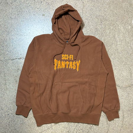 Front image of brown hoodie. Sci-fi fantasy font embroidered on chest