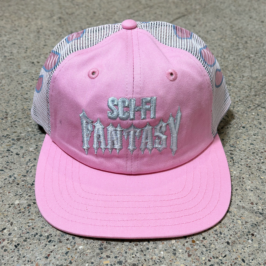 Front image of pink hat with white mesh and white embroidered logo on crown.