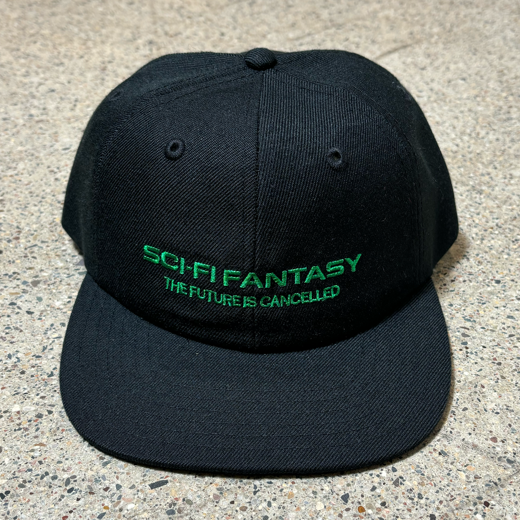 Front image of black hat with text embroidered on crown