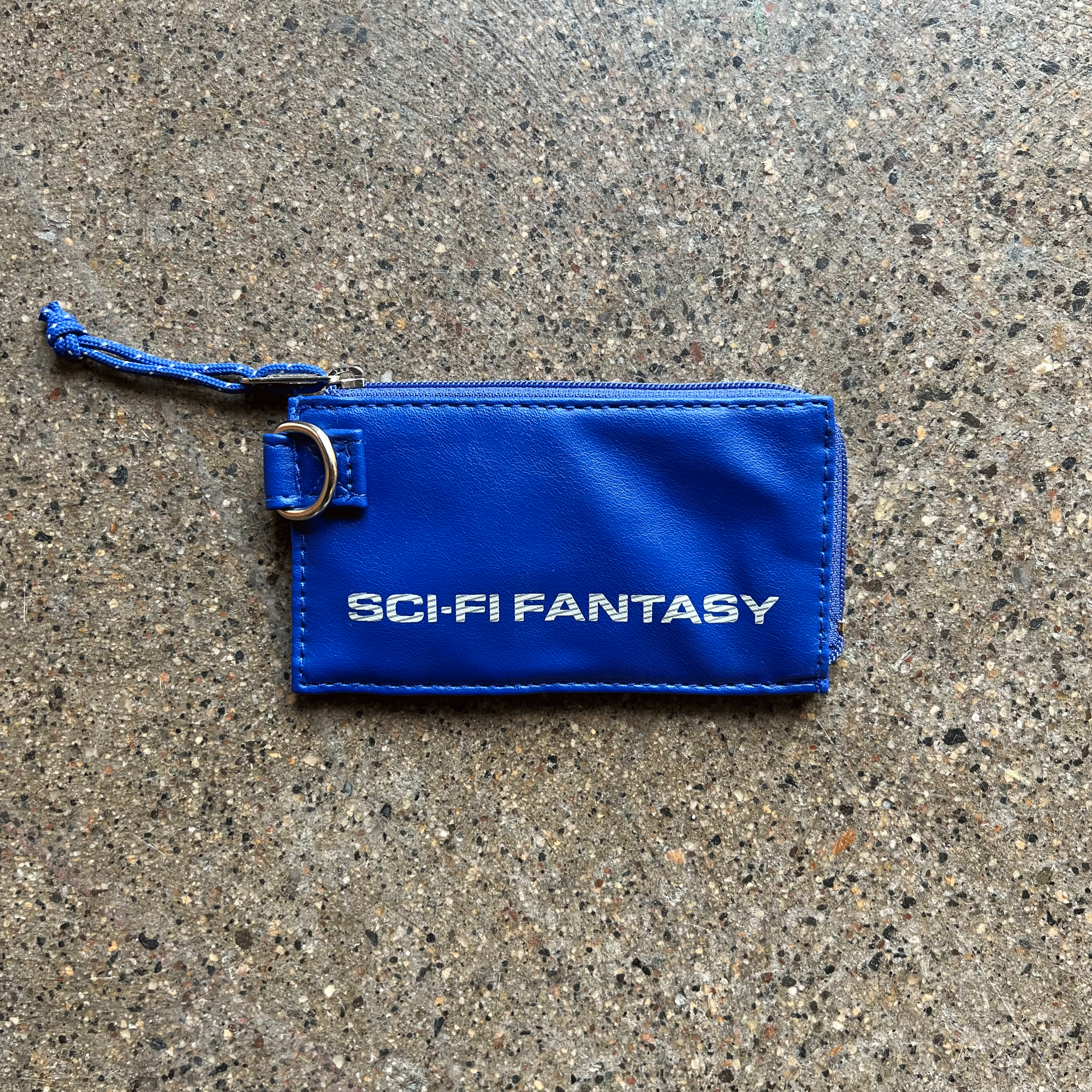 BLUE LEATHER ZIP CARD HOLDER POUCH WITH SCI-FI FANTASY LOGO PRINTED IN WHITE WITH STRIPES