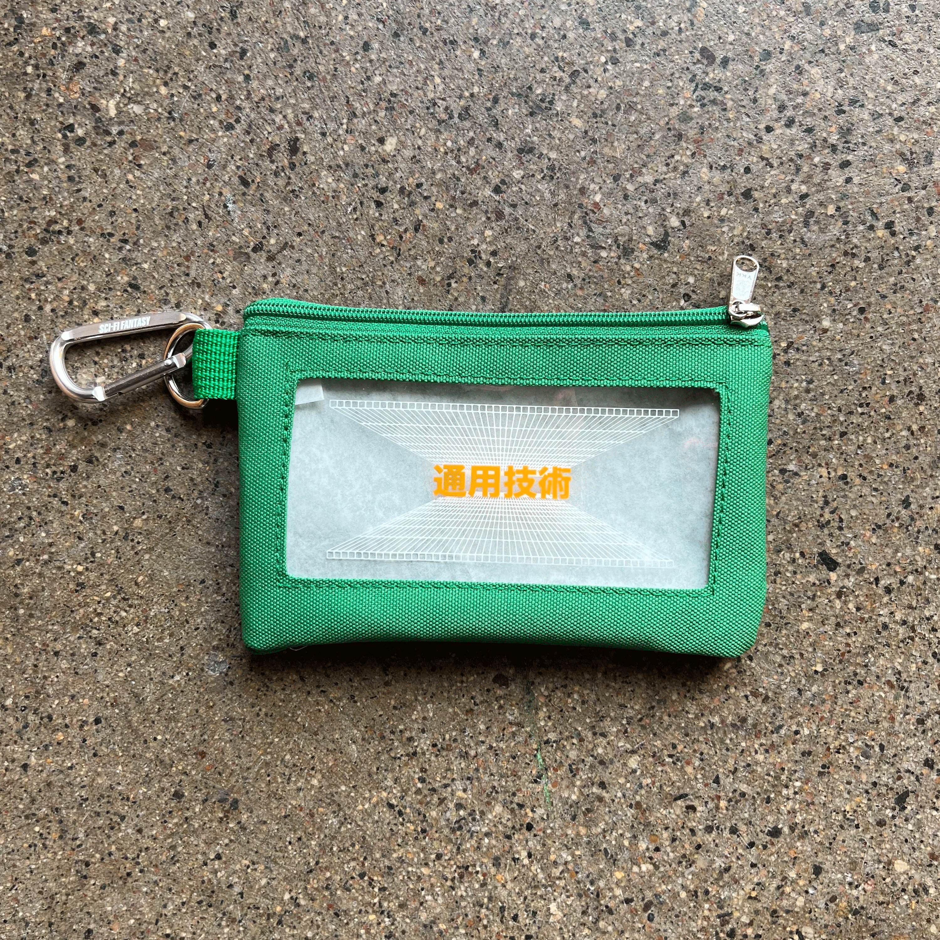 GREEN ZIP CANVAS POUCH WITH YELLOW PRINTED LOGO ON CLEAR BACKING