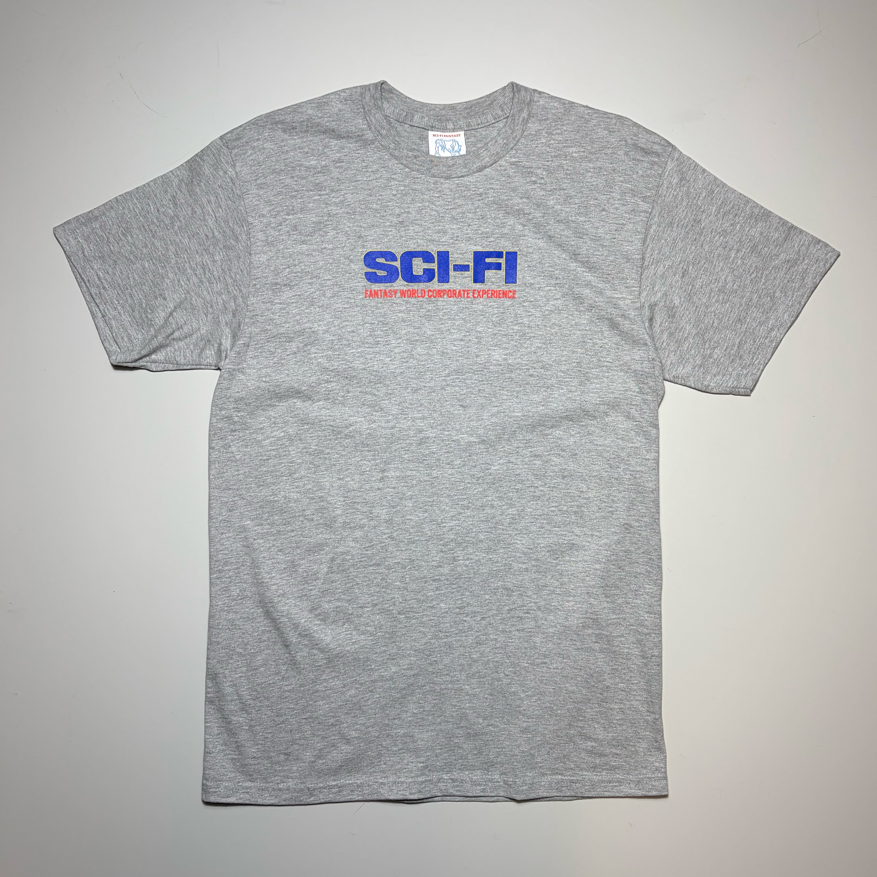 Front image of heather grey tee with blue text printed art on chest.