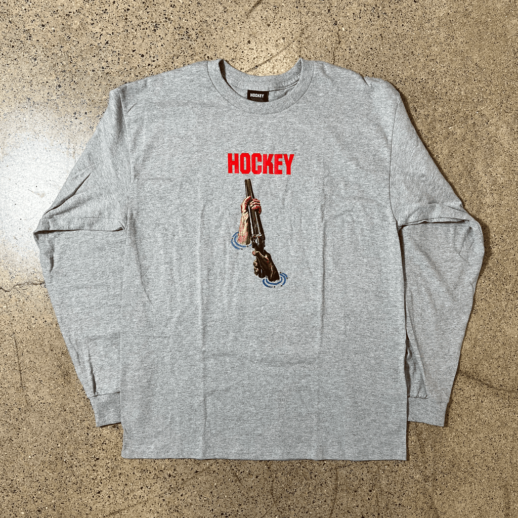 GREY LONG SLEEVE SHIRT RED HOCKEY LOGO AND DRAWING OF HANDS HOLDING SHOTGUN OUT OF WATER GRAPHIC