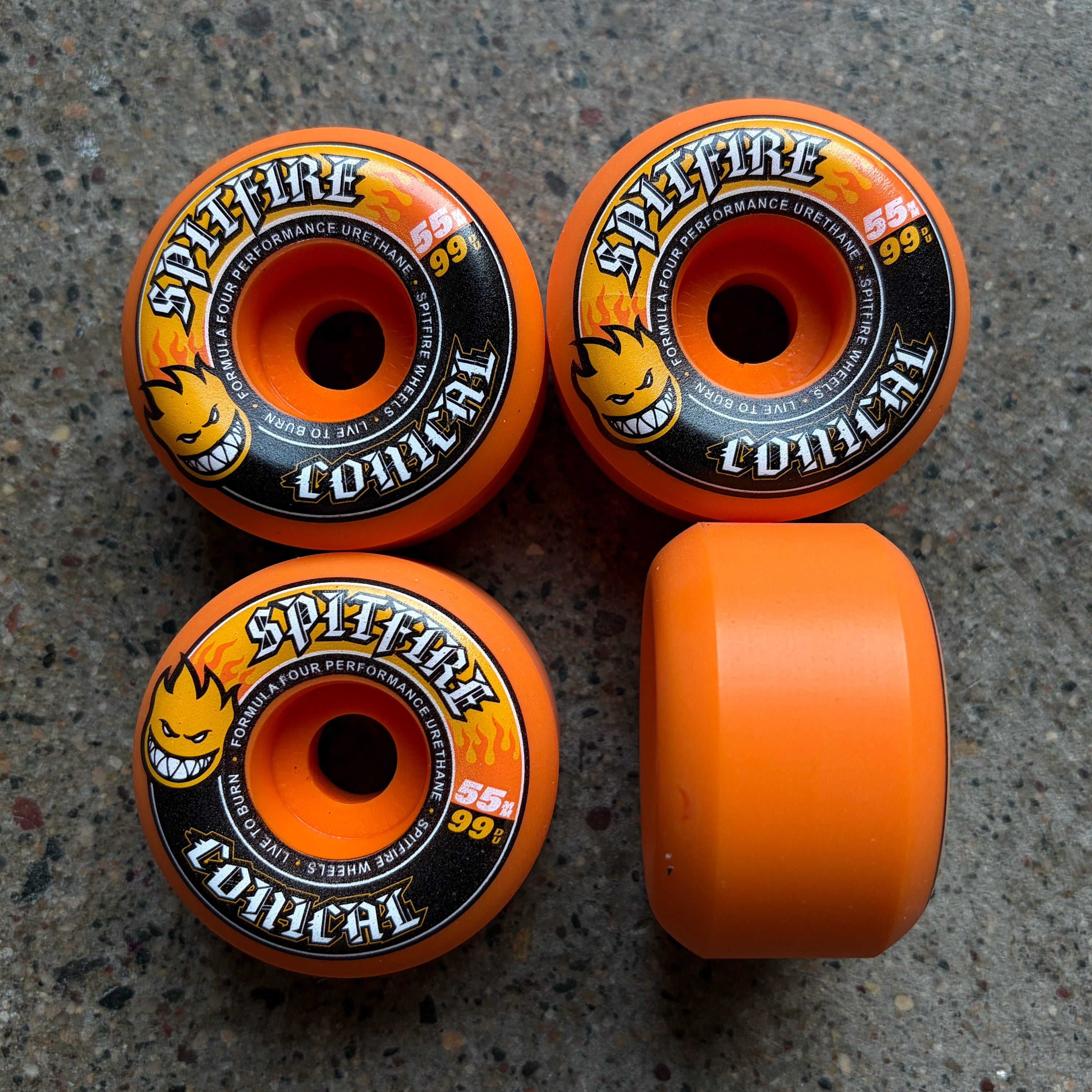 Set of 4 orange spitfire formula four conical wheels 