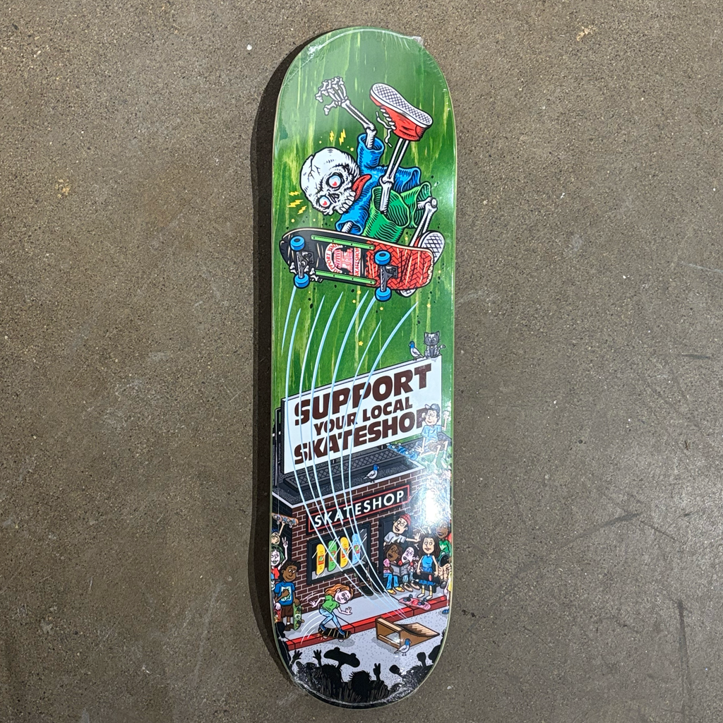 Full image of deck. Cartoon drawing of skeleton riding a skateboard over a shop.