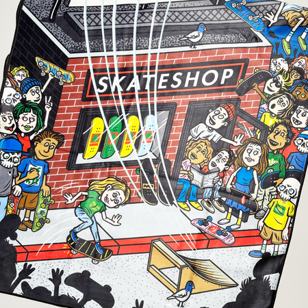 Close detail of cartoon artwork. 
Full color printed crowd in front of a skateshop.