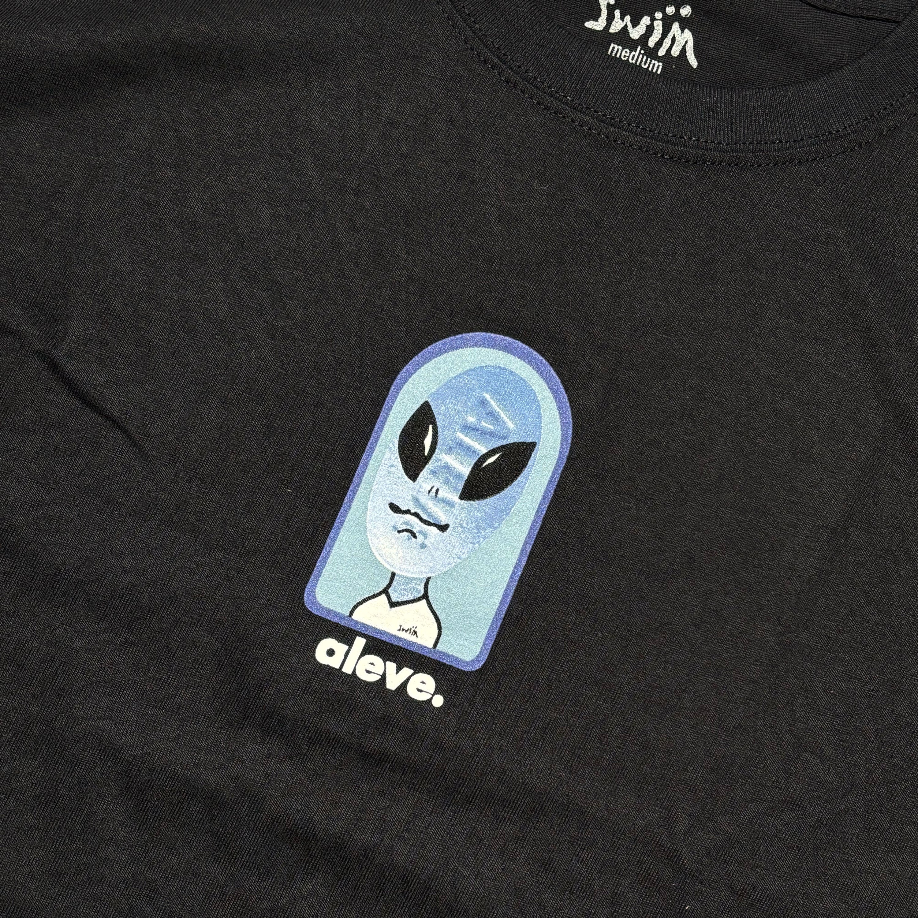 Close detail of printed art on chest.