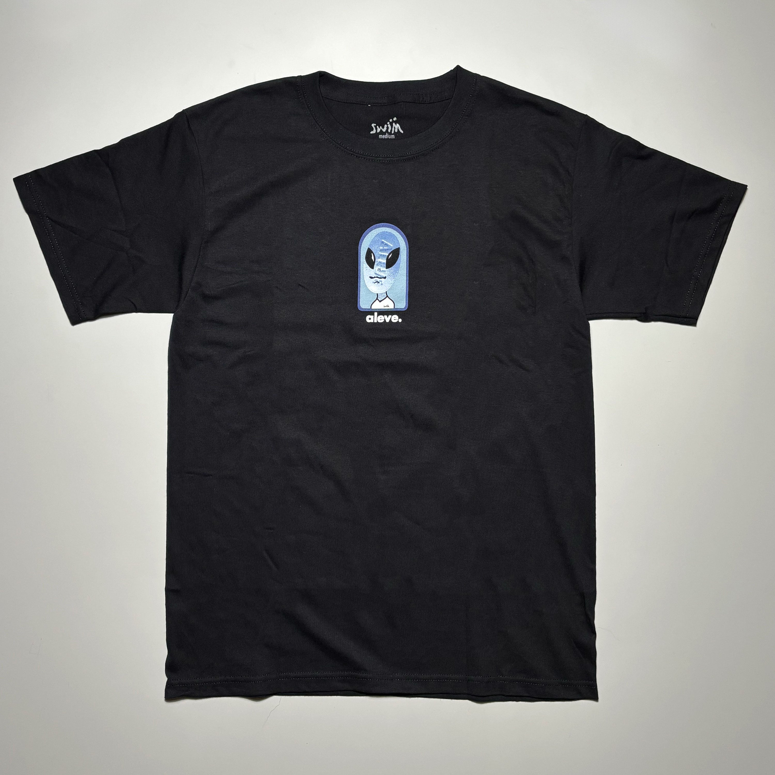 Front image of black tee with art printed on chest.