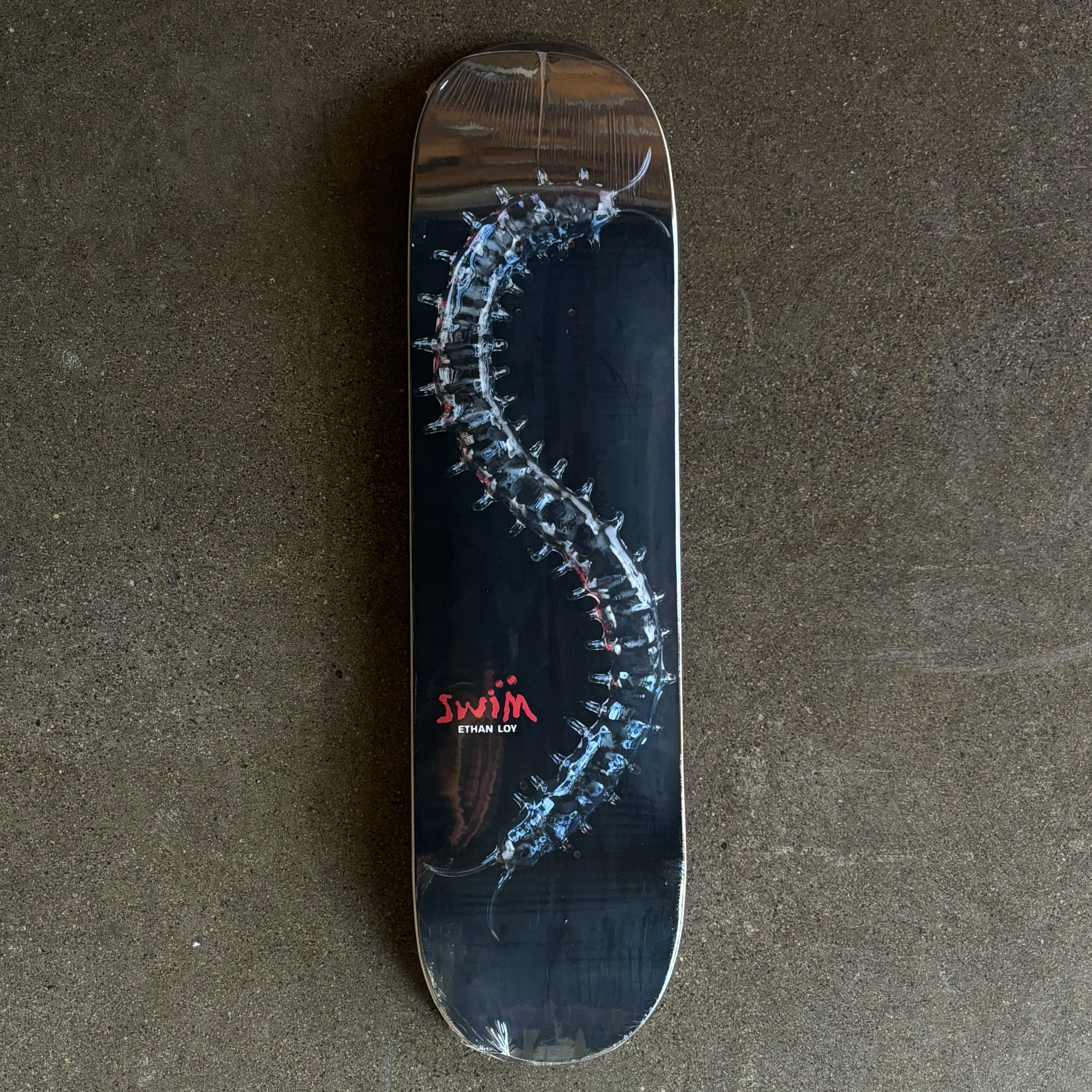 FULL IMAGE OF DECK
METALLIC CENTIPEDE WITH SWIM AND ETHAN LOY FONT IN LOWER LEFT CORNER