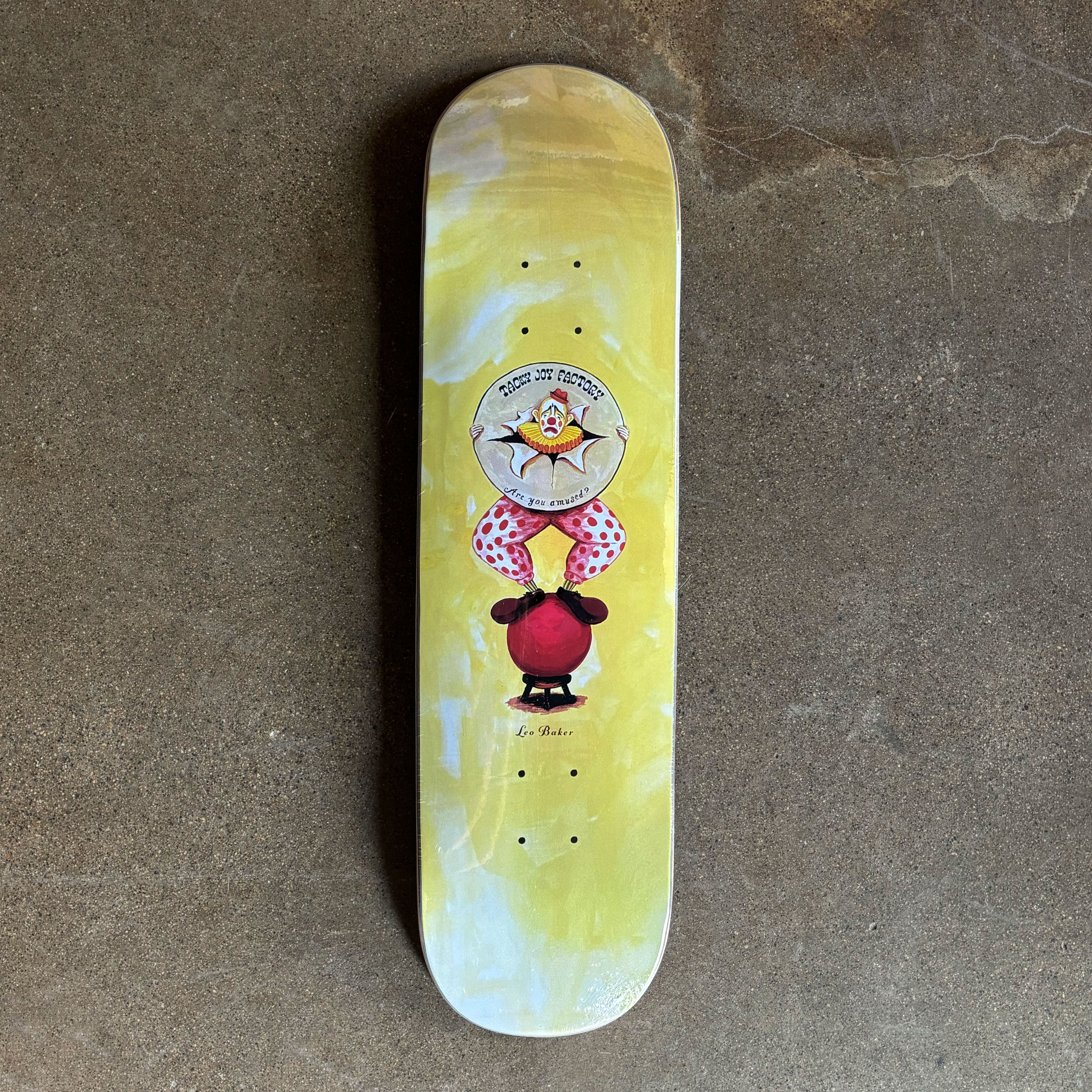 Full image of deck with painted clown art on center.