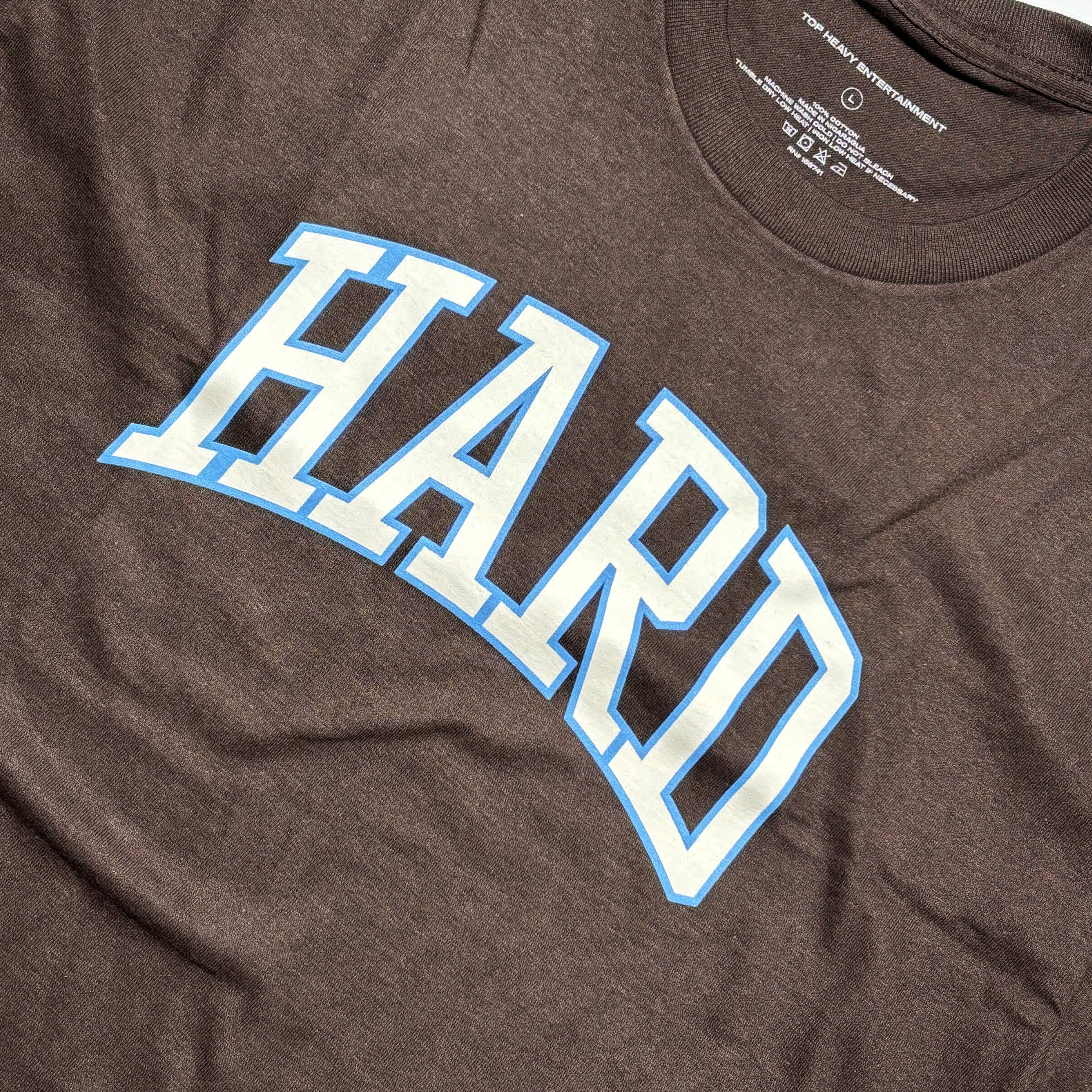 Close detail of art printed on chest in white with blue outline.