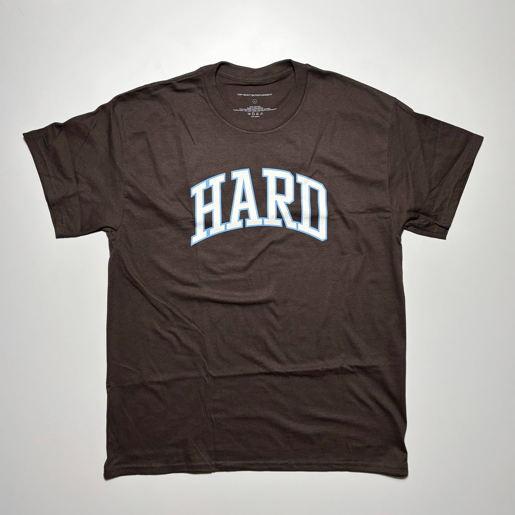 Front image of brown tee with art printed on chest.