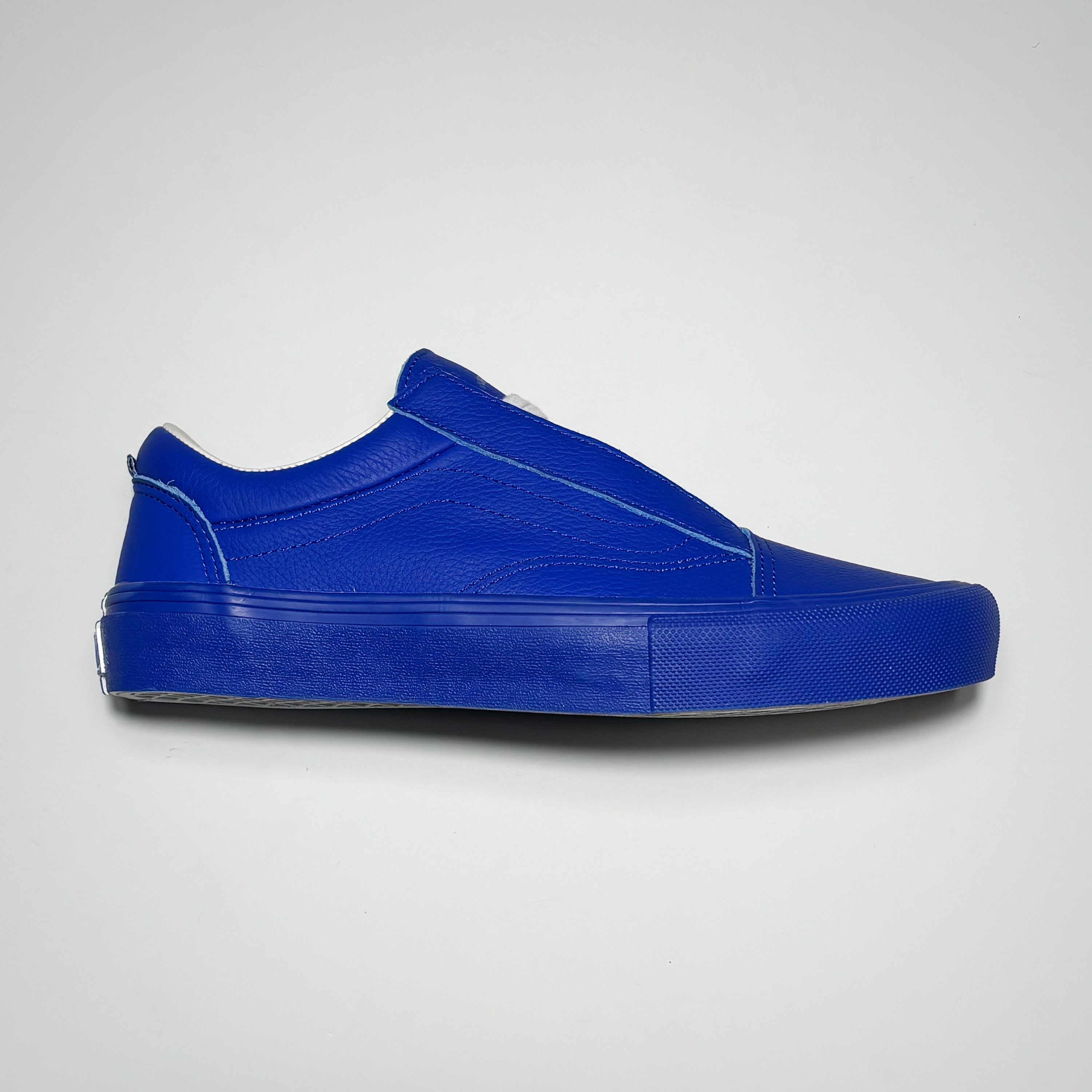 Side image of right shoe. Full blue leather with tonal blue outsole.