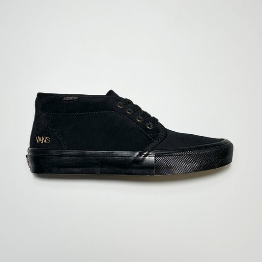 Right side image, Vans Skate Chukka sneaker by Atiba Jefferson. All black suede upper and matching tonal outsole on grey background.