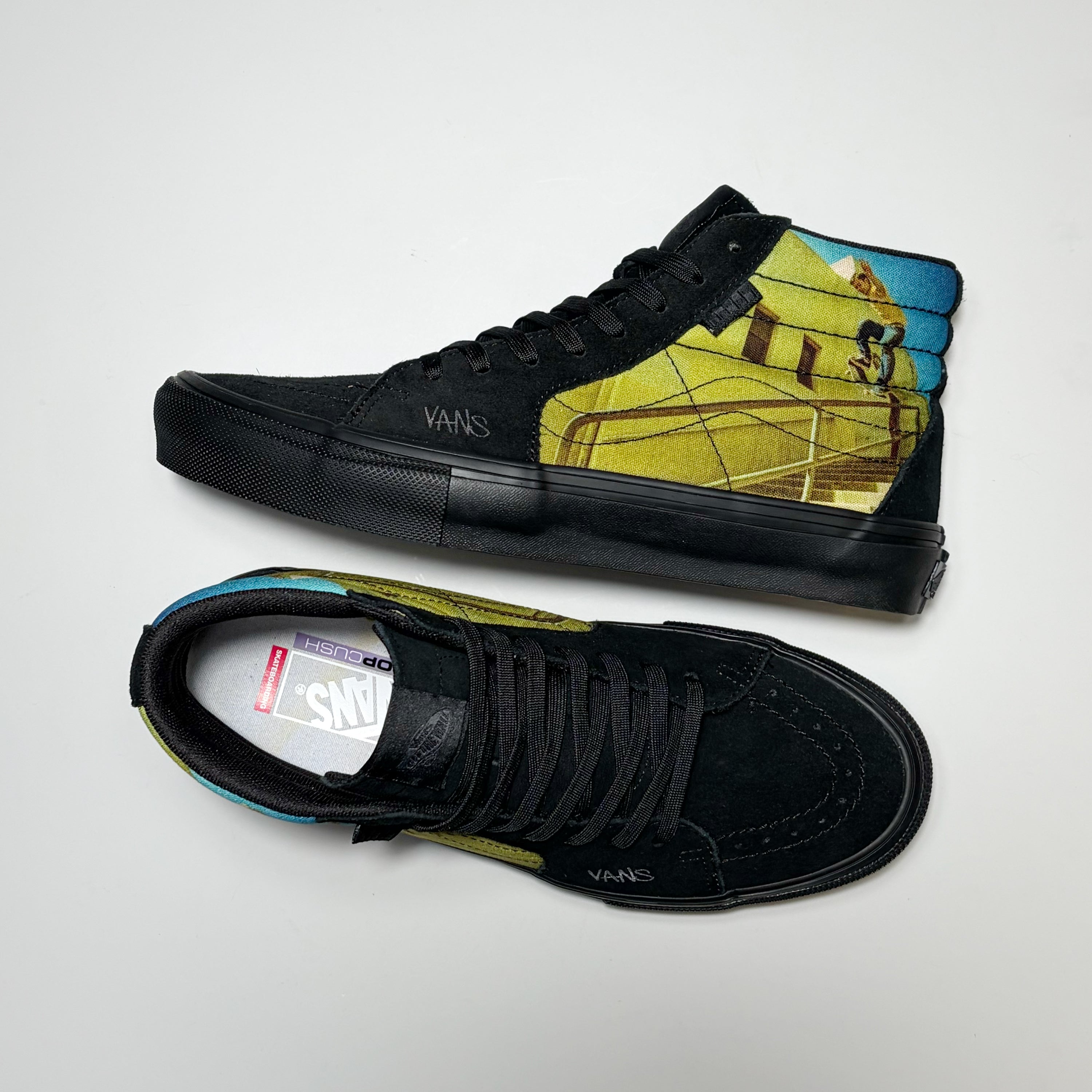 A pair of black Vans Sk8-Hi high-top sneakers with a custom graphic print on the sides. The print features a photo of Geoff Rowley shot by Atiba Jefferson